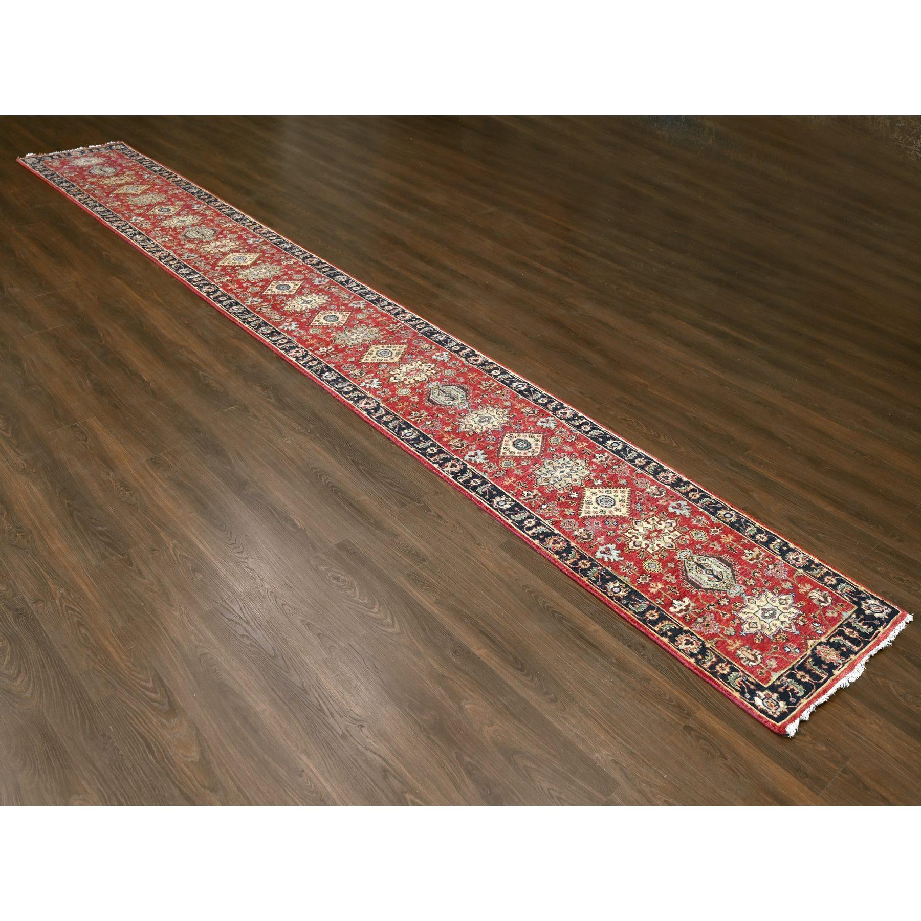This is a truly genuine one-of-a-kind Hand Knotted Karajeh Design with Tribal Medallions, Pure Wool, Oriental Rug. It has been Knotted for months and months in the centuries-old weaving craftsmanship techniques by expert artisans.
Primary materials: