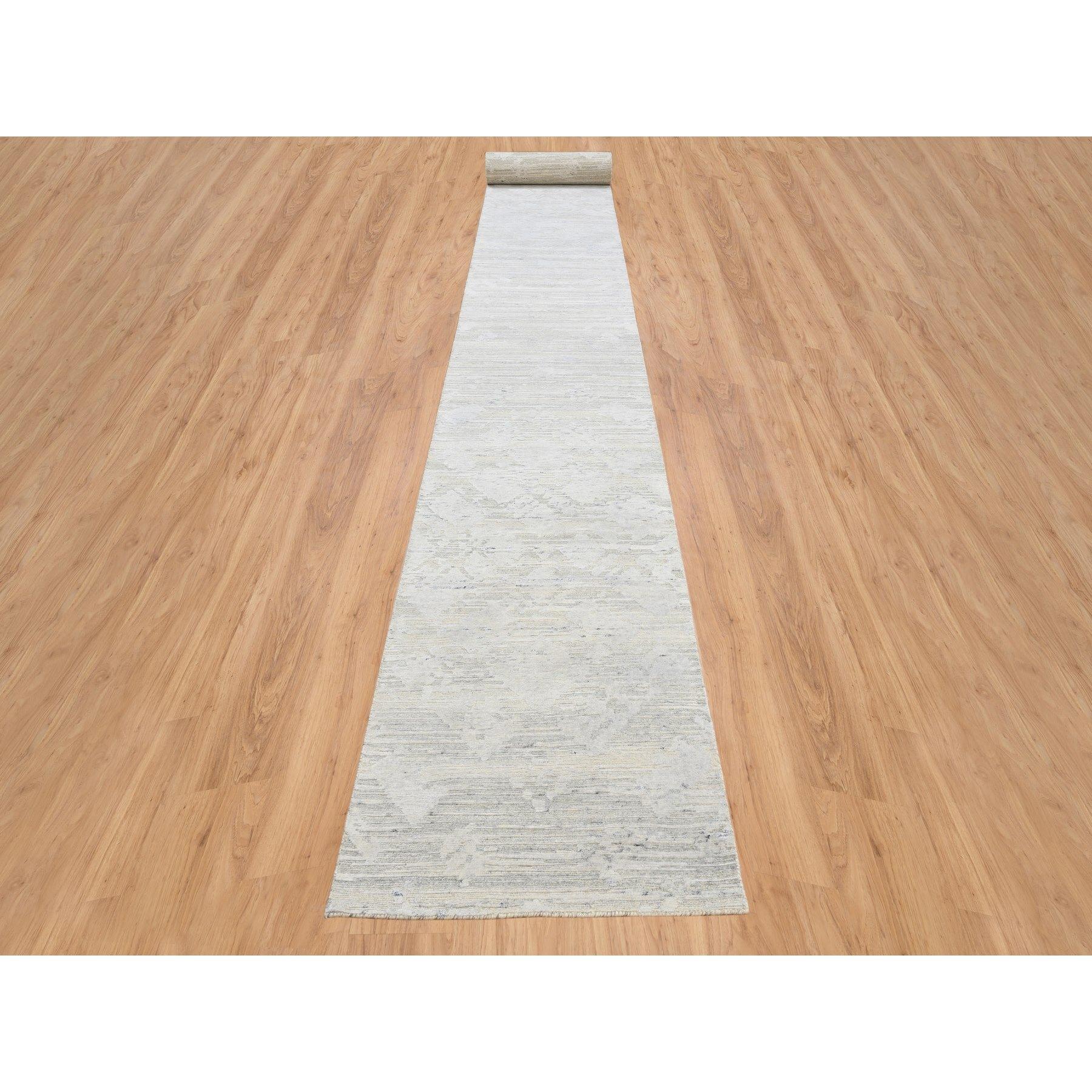 This is a truly genuine one-of-a-kind Gray Modern Hand Knotted Hand Spun Undyed Natural Wool XL Runner Oriental Rug. It has been Knotted for months and months in the centuries-old weaving craftsmanship techniques by expert artisans.
Primary