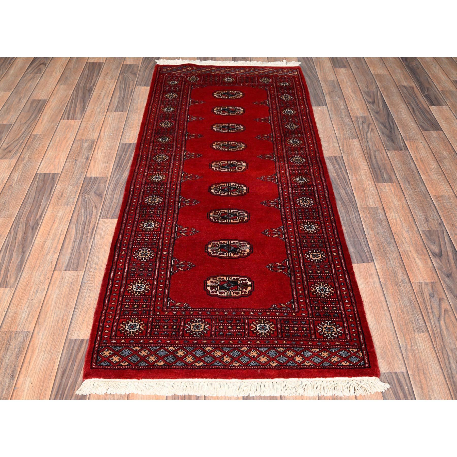 Crimson Red, Soft and Shiny Wool, Hand Knotted, Princess Bokara with Tribal Medallions, Narrow Runner, Oriental Rug
Primary materials: Wool
Latex: No Pile 
height: 0.25 Inches
Style: Traditional
Primary color: Red
Secondary colors: Red, Ivory, Blue,
