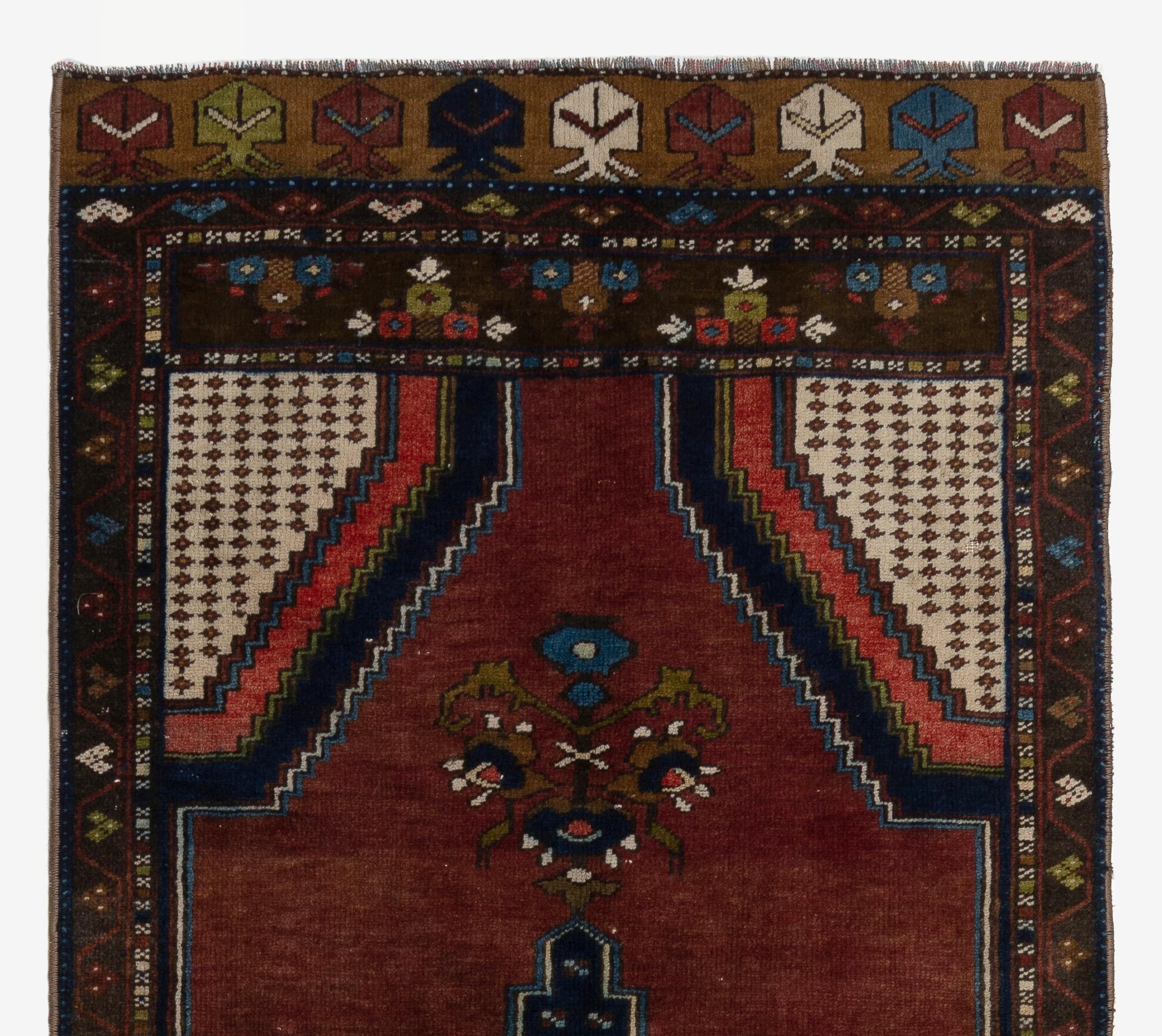 A finely hand-knotted vintage Turkish carpet from 1960s featuring a geometric medallion design. The rug is made of medium wool pile on wool foundation. It is heavy and lays flat on the floor, in very good condition with no issues. It has been washed