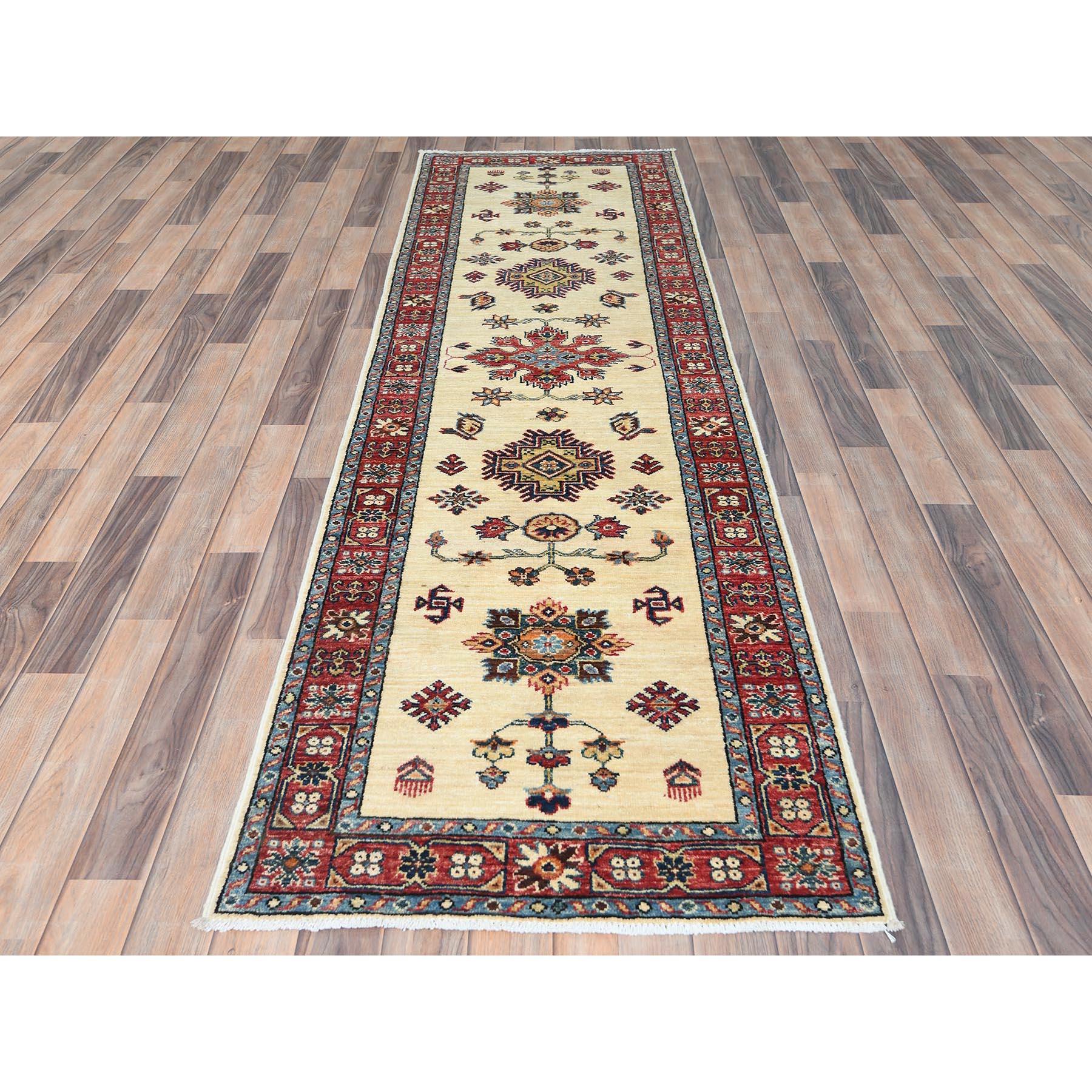 Ivory, Dense Weave Extra Soft Wool, Hand Knotted Afghan Super Kazak Natural Dyes, Runner Oriental Rug
Primary materials: Wool
Latex: No Pile 
height: 0.25 Inches
Style: Traditional
Primary color: Ivory
Secondary colors: Red, Blue, Yellow, Brown,