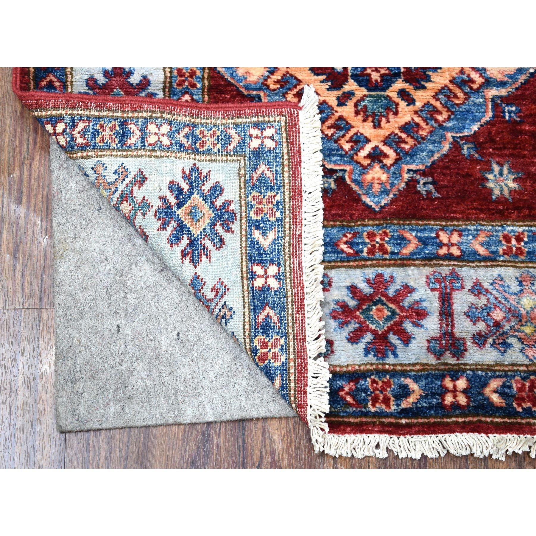This is a truly genuine one-of-a-kind Red Hand-Knotted Geometric Design Super Kazak Pure Wool Oriental Runner Rug. It has been Knotted for months and months in the centuries-old weaving craftsmanship techniques by expert artisans.
Primary materials: