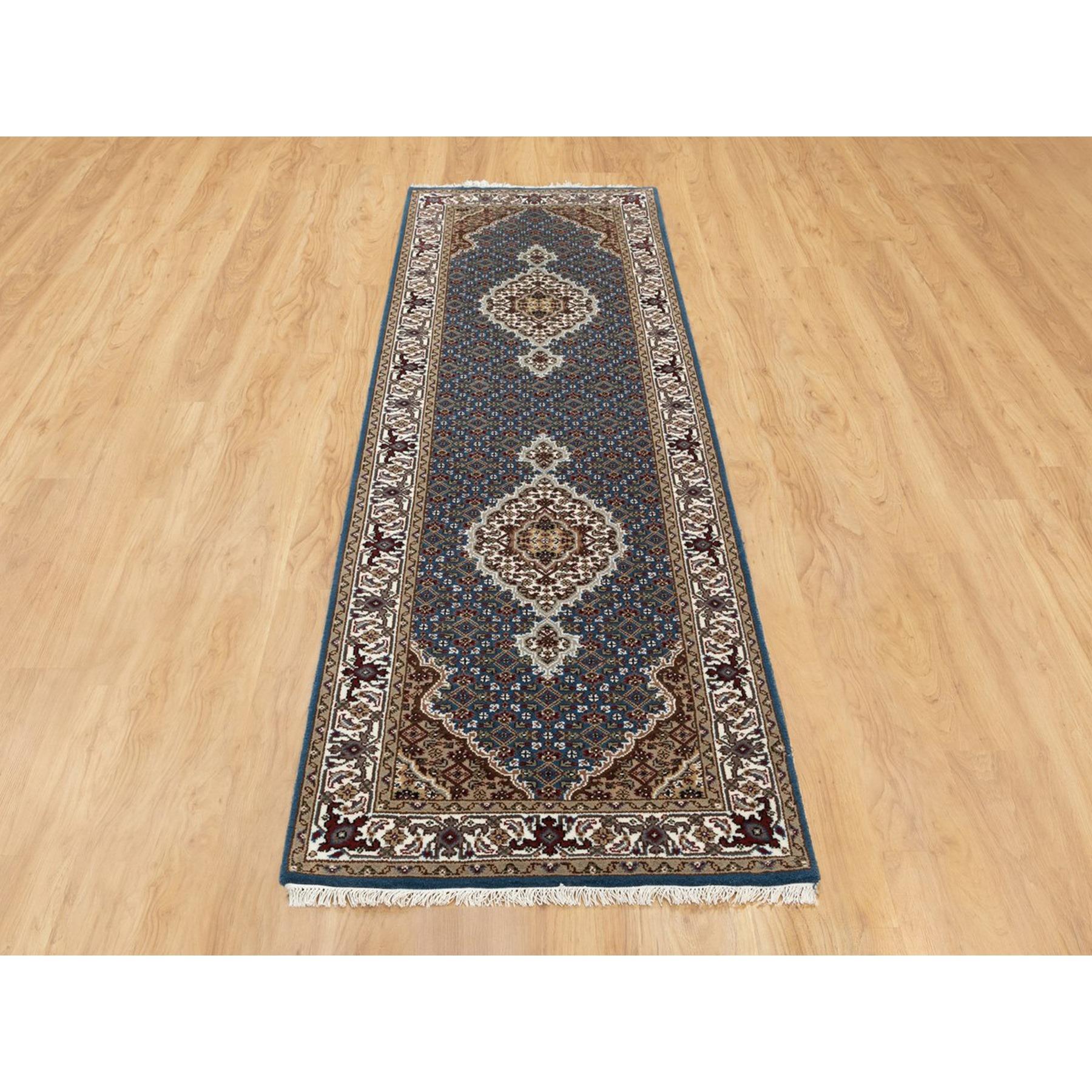 This is a truly genuine one-of-a-kind Denim Blue Hand Knotted Fish Design Tabriz Mahi Wool And Silk Oriental Runner Rug. It has been Knotted for months and months in the centuries-old weaving craftsmanship techniques by expert artisans.
Primary