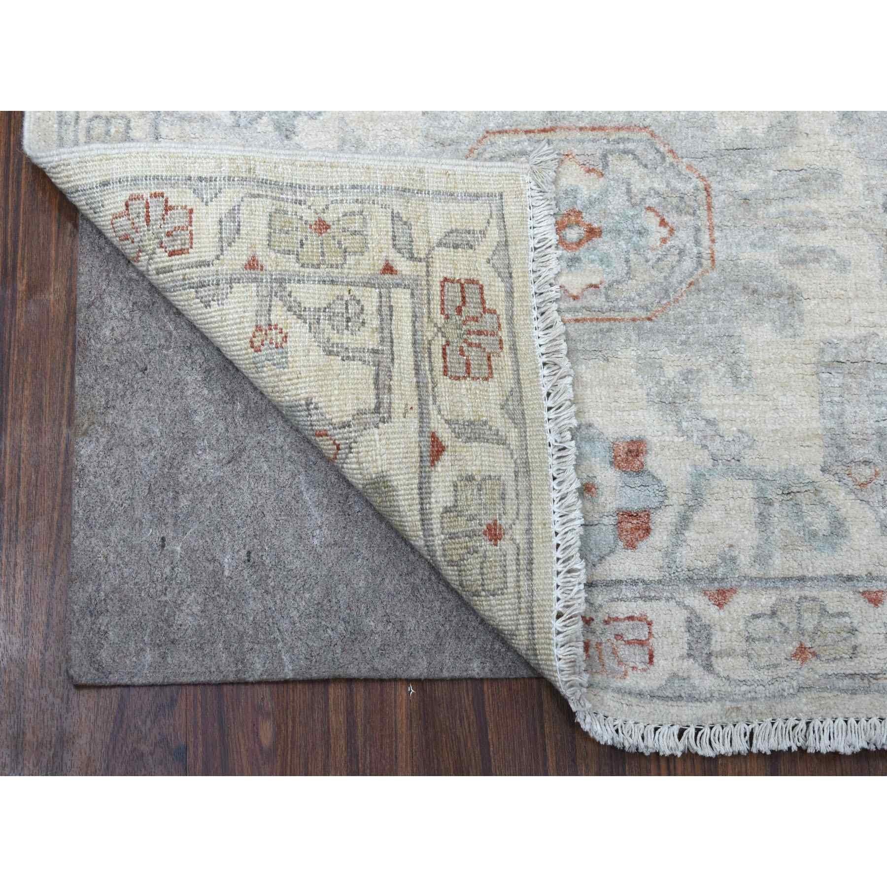 This is a truly genuine one-of-a-kind Ivory Washed Out Peshawar Organic Wool Hand Knotted Runner Oriental Rug. It has been woven for months and months in the centuries-old Persian weaving craftsmanship techniques by expert artisans.
Primary