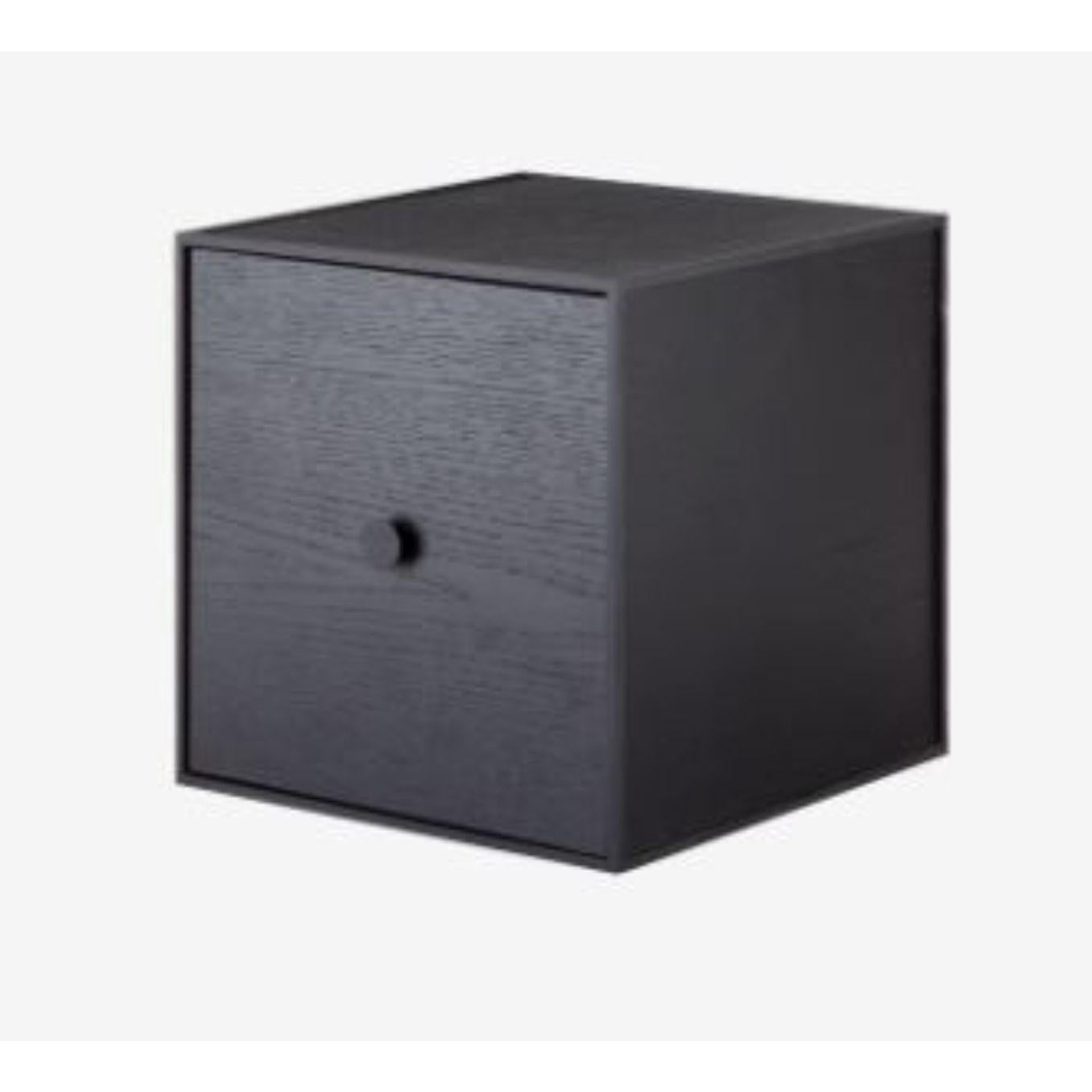 28 black ash frame box with door by Lassen
Dimensions: W 28 x D 28 x H 28 cm 
Materials: Finér, Melamin, Melamin, Melamine, Metal, Veneer,
Also available in different colors and dimensions. 

By Lassen is a Danish design brand focused on iconic