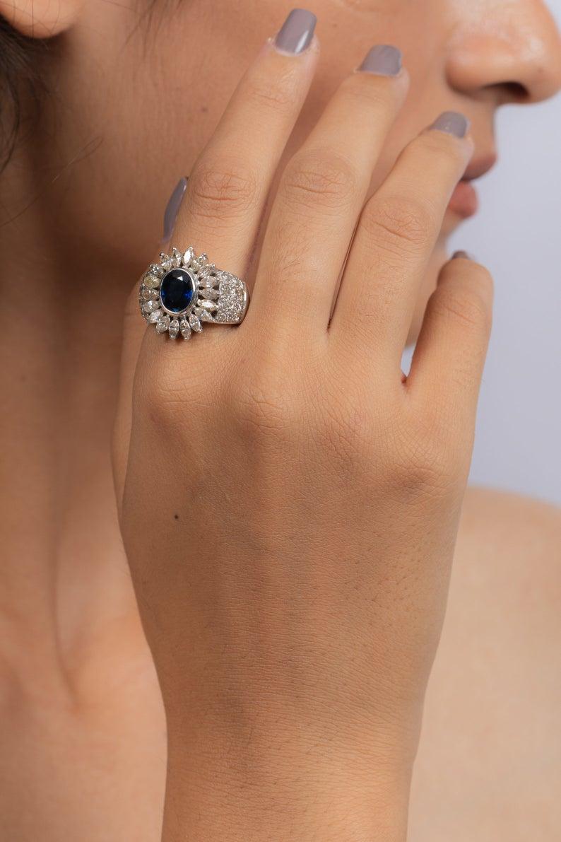 This ring has been meticulously crafted from 14-karat white gold.  It is hand set with 1.09 carat blue sapphire & 1.21 carats of sparkling diamonds. 

The ring is a size 7 and may be resized to larger or smaller upon request. 
FOLLOW  MEGHNA JEWELS