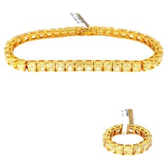 28 Carat Cushion Shaped VS Fancy Light Yellow Diamond Bracelet and Ring Suite