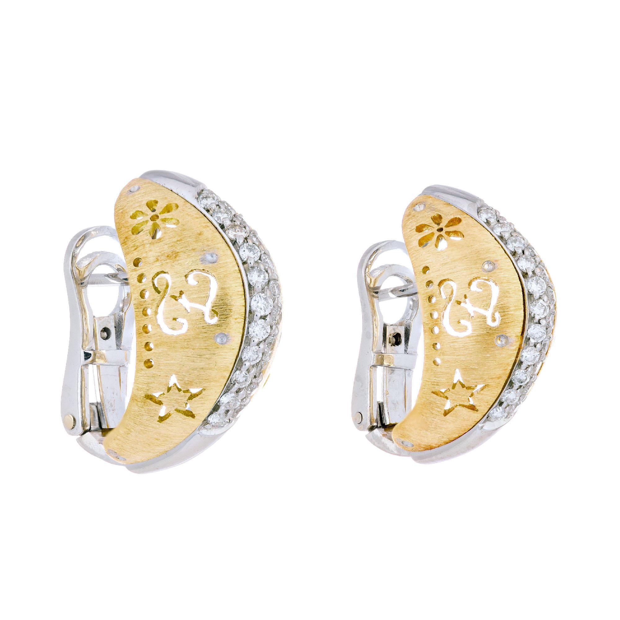 Hand pierced domed clip post lever back 18k yellow and white gold diamond earrings. Script on the side of each earring with 2 rows of diamonds down the middle. 

44 round brilliant cut diamonds, approx. total weight .28cts, G-H, VS
Tested:
