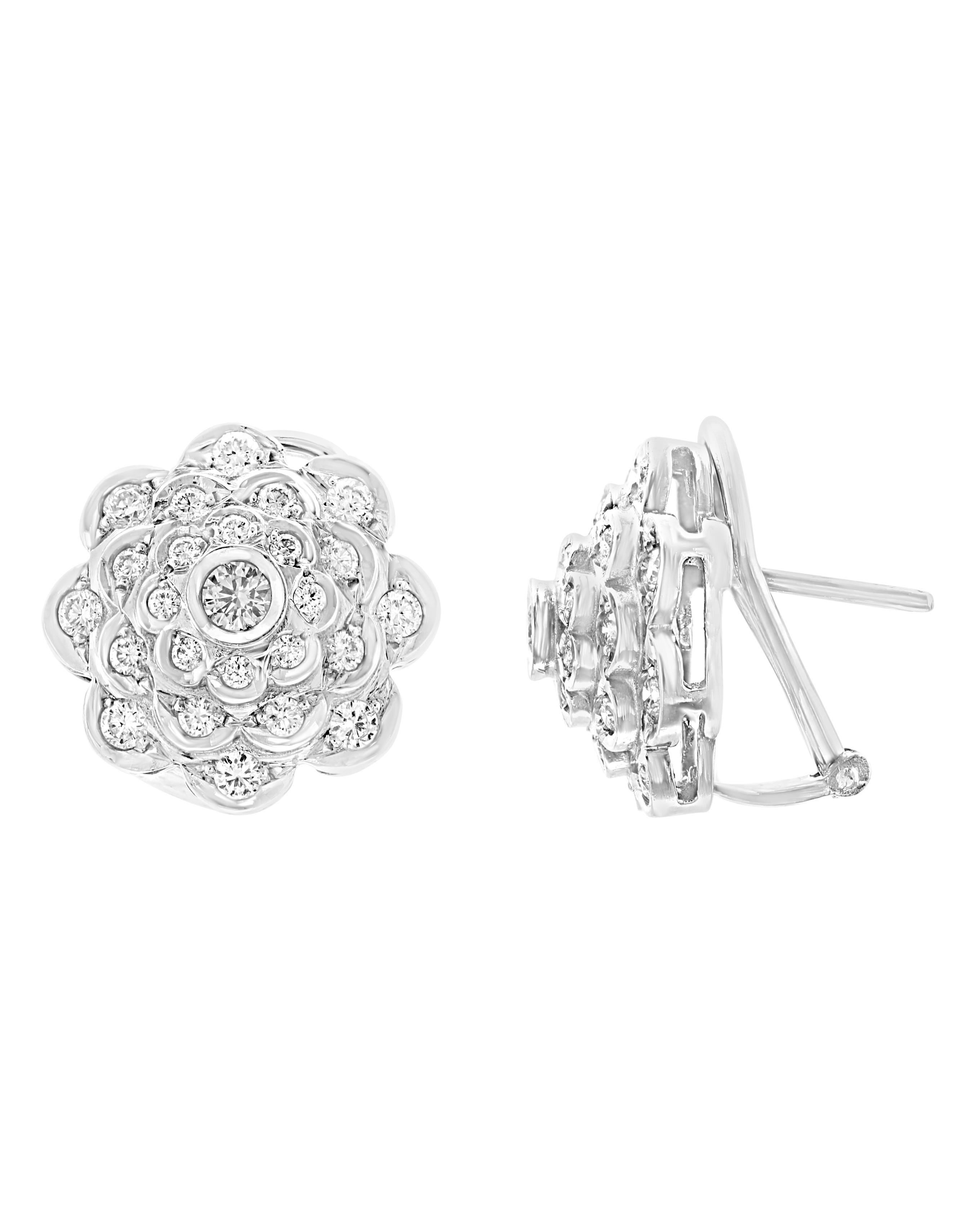 A fabulous pair of earrings with an enormous amount of look and sparkle!
2.8 carats of F-G color VS clarity diamonds set in solid 18 karat white gold  with omega backs.
Cluster earrings, featuring a center round  diamond  surrounded by  round
