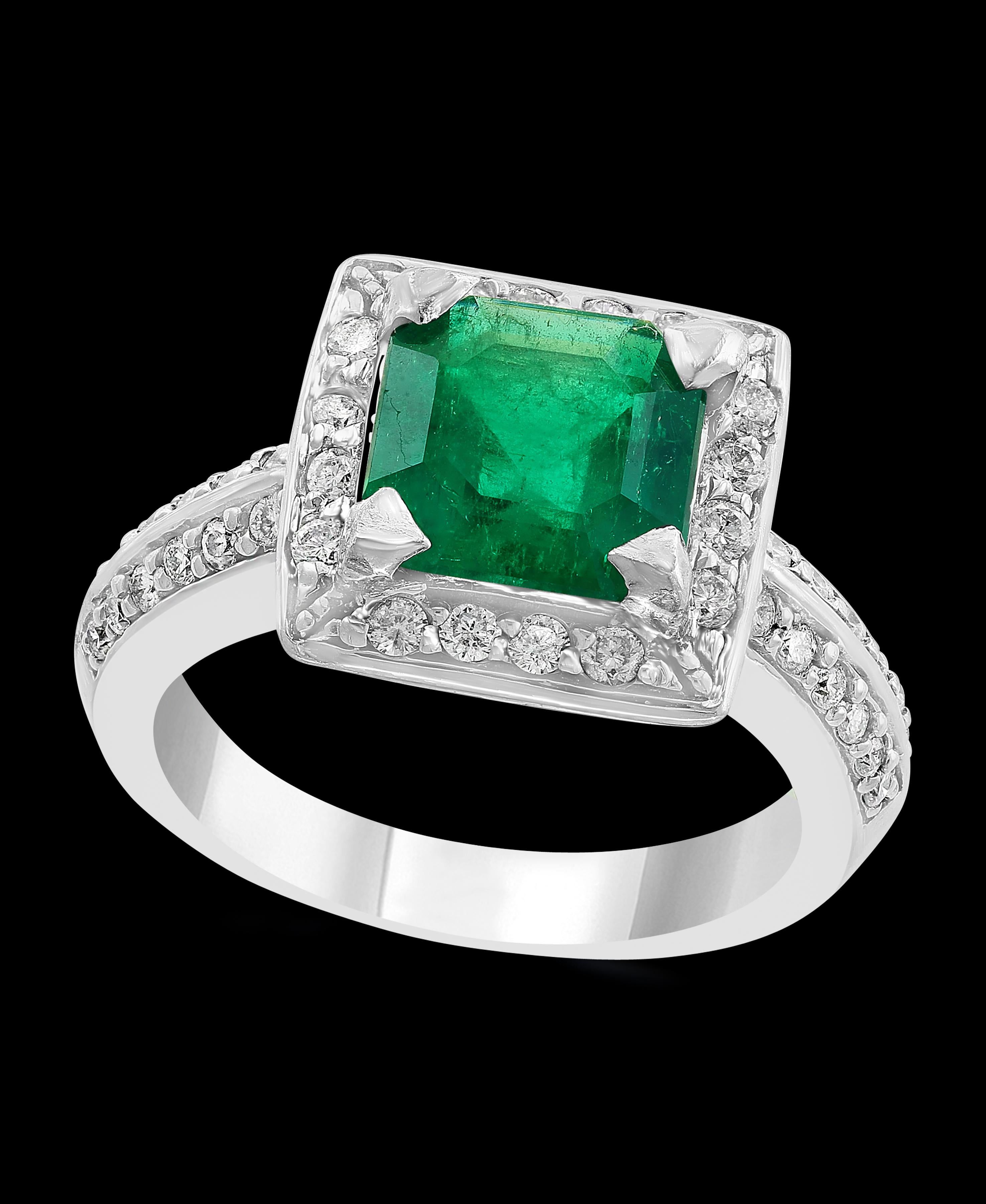 A classic, Cocktail ring 
2.8 Carat  Colombian Emerald and Diamond Ring, Estate, no color enhancement.
Gold: 14 carat white gold 
Weight: 7.5 gm
 Diamonds: approximate 0.85 Carat 
Emerald: 2.8 Carat 
Ring size 6.7
Origin : Colombia 
Color: Deep 