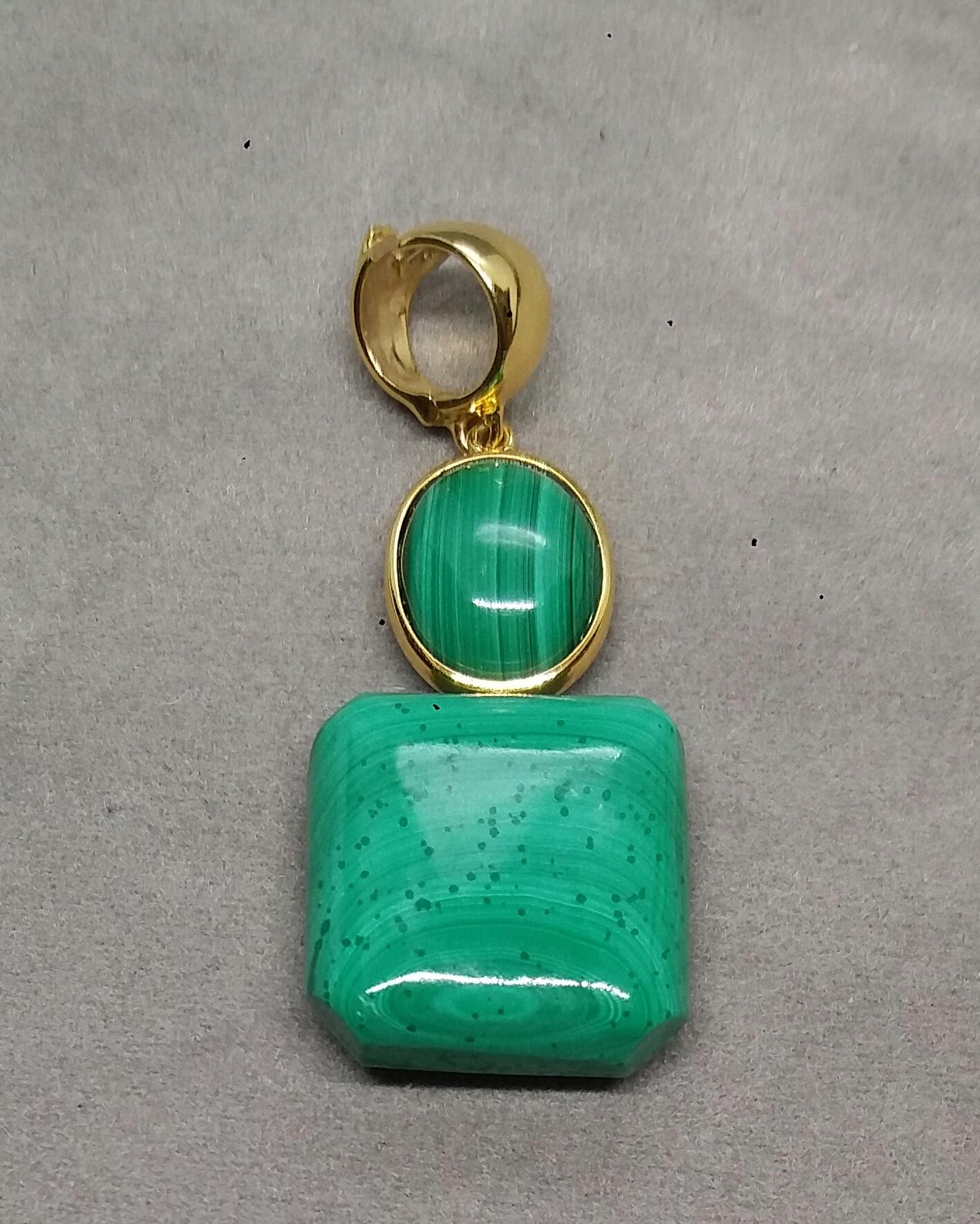Excellent quality Malachite Octagon shape suspended from a oval Malachite cabochon set in 14k. yellow gold bezel...On top an handmade enhancer can be opened to attach it in a beads necklace to easily clip on and remove anytime.