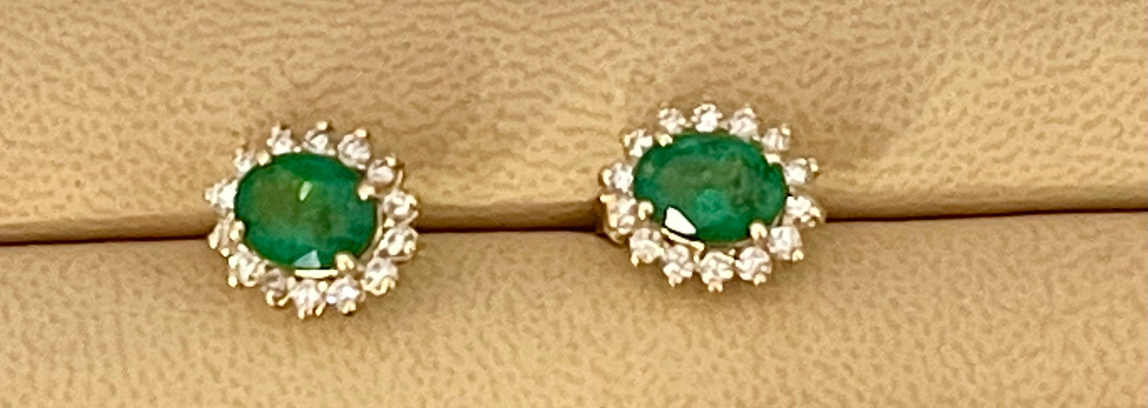 Women's 2.8 Carat Oval Shape Emerald and Diamond Post Back Earrings 14 Karat Yellow Gold