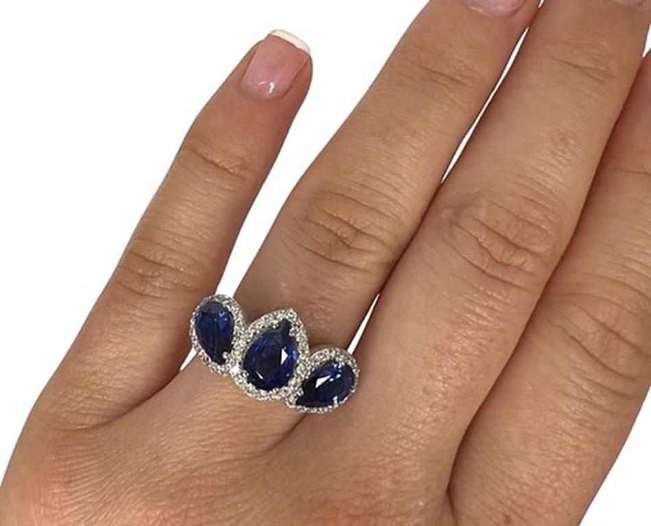 Sapphire Weight:2.81 CTs, Measurements: 8x6/7x5 mm, Diamond Weight: 0.47 CTs (1.3 mm), Metal: 18K White Gold, Gold Weight: 6.04 gm, Ring Size: 7, Shape: Pear, Color: Blue, Hardness: 9, Birthstone: September