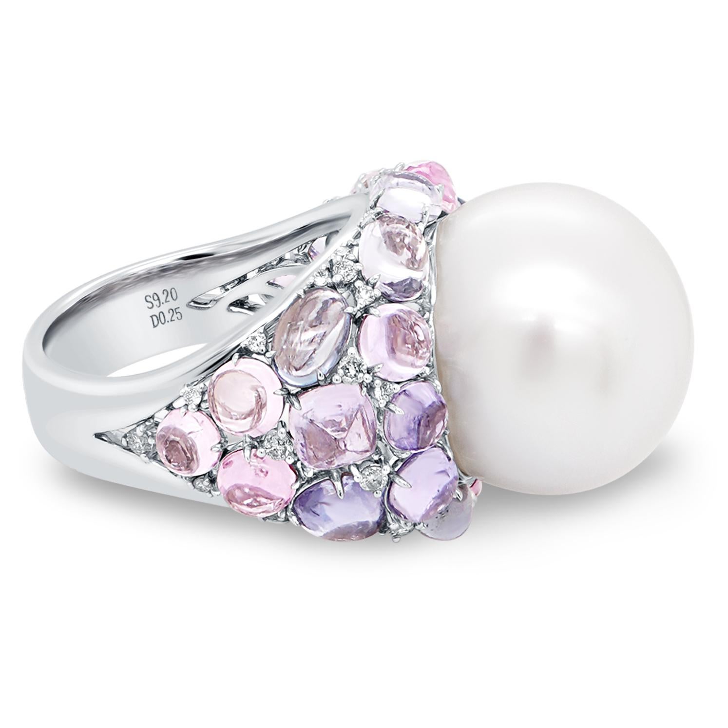A 28 Carat South Sea Pearl is set along side 8 carat of no heat sapphire cabochons and 0.25 carat of white round brilliant diamond. 
South Sea pearls are generally much larger than other pearl types and have a unique luster quality – a soft