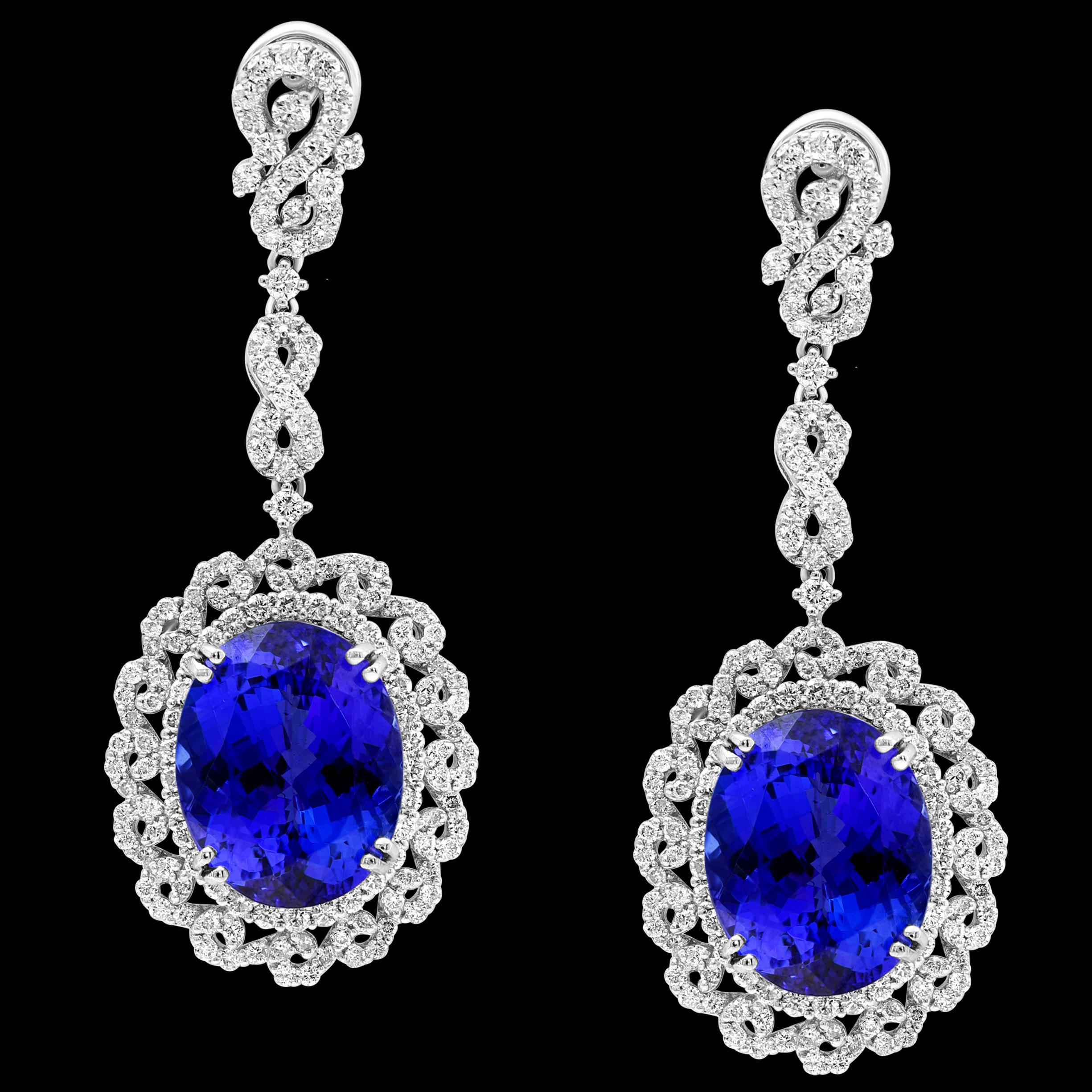 28 Carat Oval Tanzanite and Diamond Hanging or Cocktail Earring 18 Karat White Gold
perfect pair made in 18 carat White gold . 
18 K gold : 17.8 Grams
Diamonds: approximate 4.5 ct carats
Tanzanite: 28 Carats
We encourage you to take a look at all