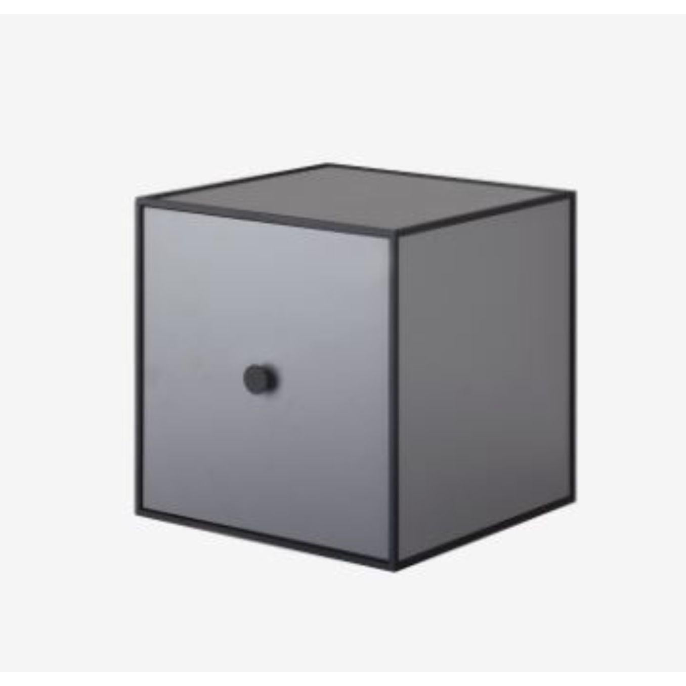 28 Dark grey frame box with door by Lassen
Dimensions: W 28 x D 28 x H 28 cm 
Materials: finér, melamin, melamin, melamine, metal, veneer
Also available in different colors and dimensions. 

By Lassen is a Danish design brand focused on iconic