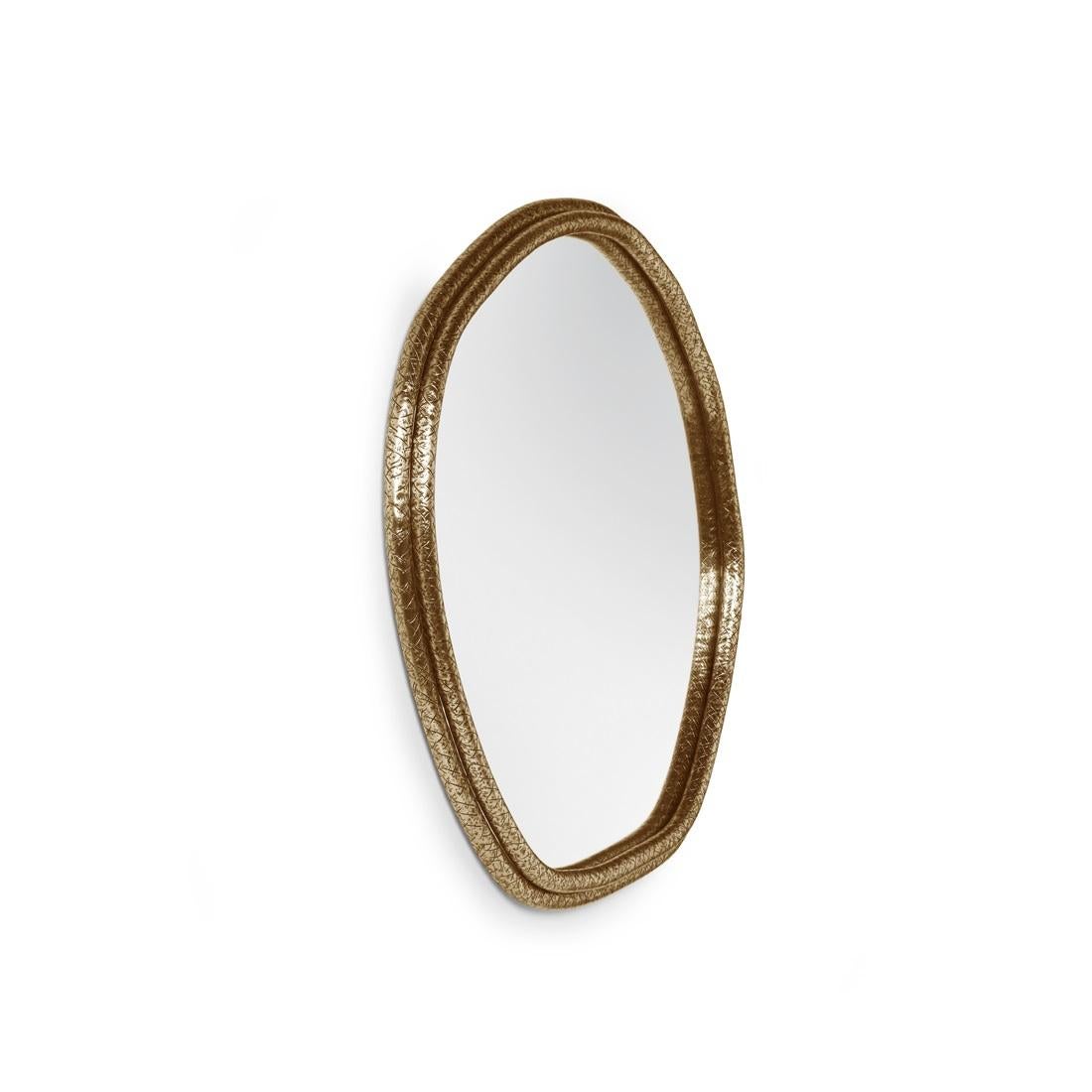 The arches of this mirror are hand hammered in brass, shaped around a tree trunk. The mirror here represents time as a flat quasi-elliptical shape, therefore everlasting..
Frame: Brass, Nickel or Copper in jagged hammered finishing.
Mirror: Clear,