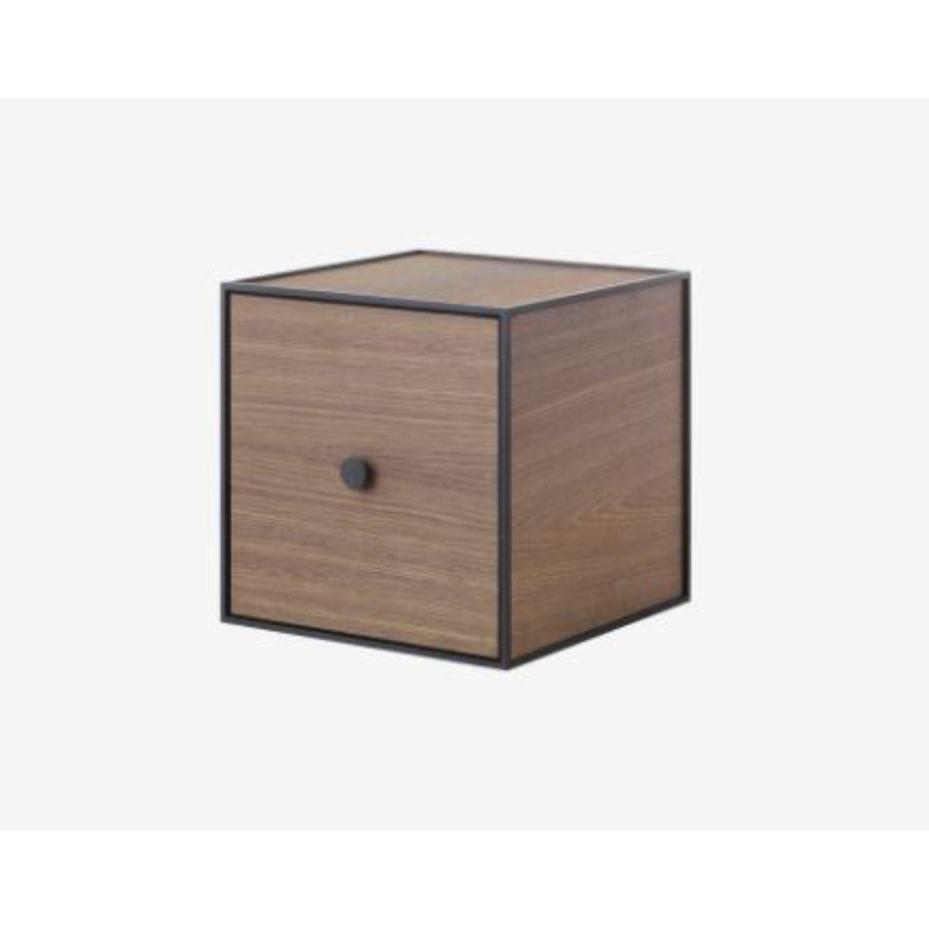 28 smoked oak frame box with door by Lassen
Dimensions: W 28 x D 28 x H 28 cm 
Materials: Finér, Melamin, Melamin, Melamine, Metal, Veneer
Also available in different colors and dimensions. 

By Lassen is a Danish design brand focused on iconic