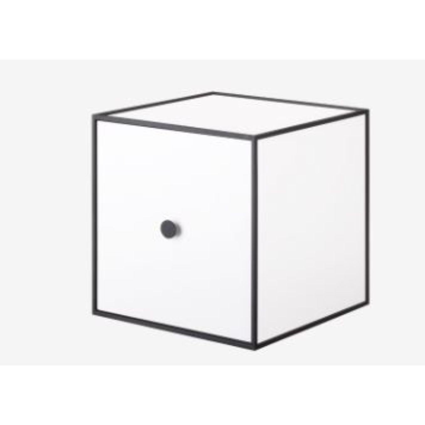 28 white frame box with door by Lassen
Dimensions: W 28 x D 28 x H 28 cm 
Materials: Finér, Melamin, Melamin, Melamine, Metal, Veneer
Also available in different colors and dimensions. 

By Lassen is a Danish design brand focused on iconic