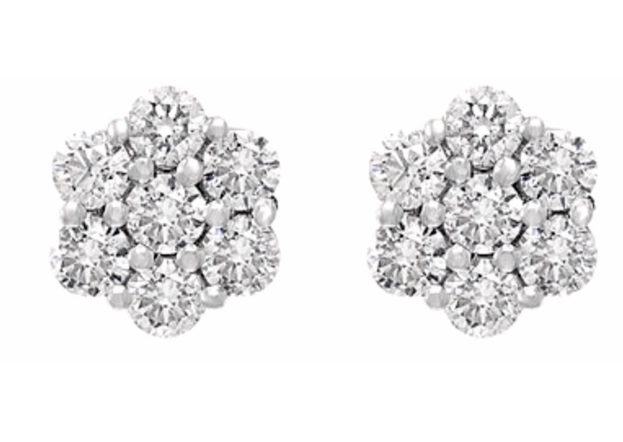 A sweet, shimmery style for any day of the week. These stud earrings blossom floral clusters of  2.80 ct. t.w. round brilliant-cut diamonds. Set in 14kt Yellow gold. Post, Screw back diamond floral cluster stud earrings.
It's  a unique and playful