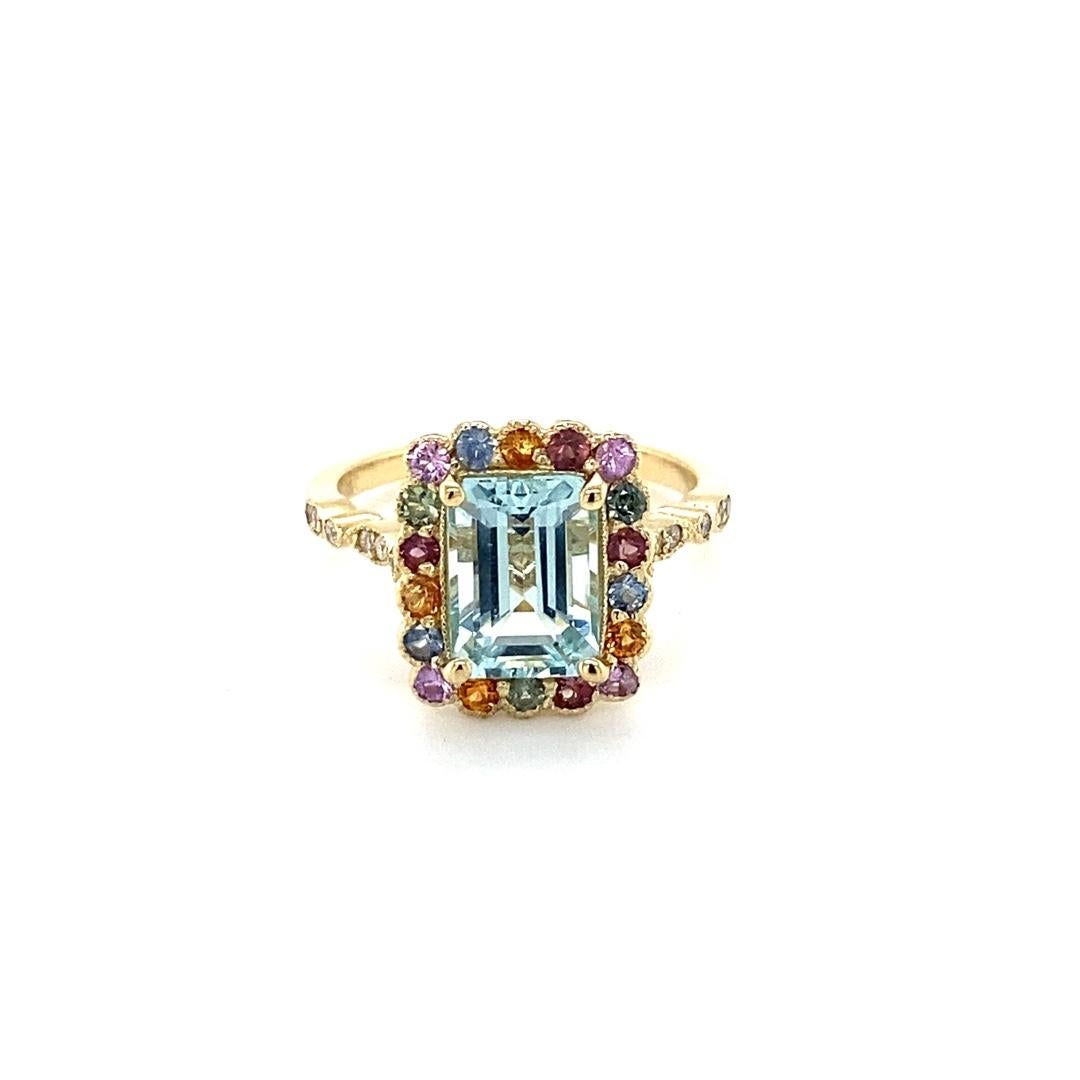 2.80 Carat Aquamarine Multi Color Sapphire Diamond Yellow Gold Cocktail Ring

This ring has a gorgeous 2.03 Carat Emerald Cut Aquamarine and is surrounded by 18 Natural Multi-Colored Sapphires that weigh 0.67 carats and 12 Round Cut Diamonds that