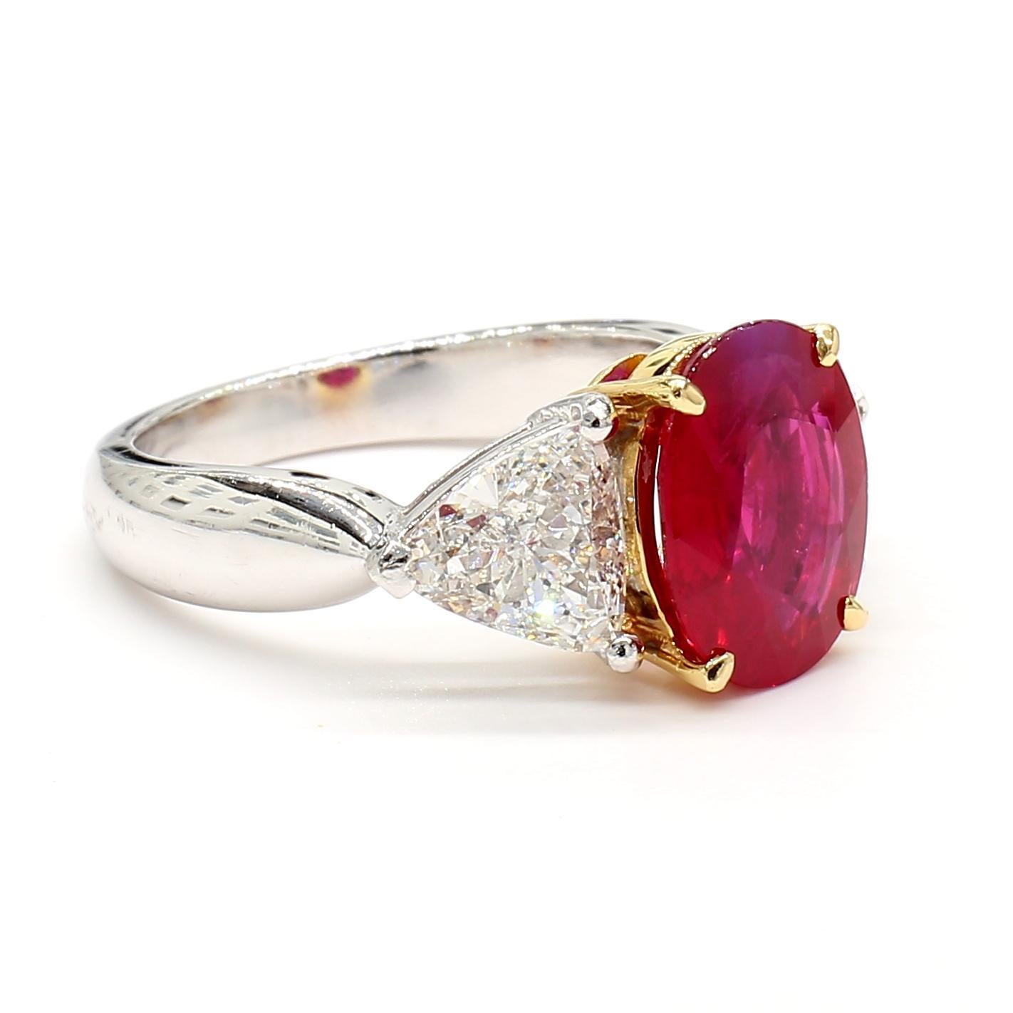 Experience timeless elegance with this exquisite Ruby and Diamond Ring, meticulously crafted in luxurious platinum. At its center, a striking 2.80-carat red ruby commands attention with its deep, passionate hue, symbolizing love and sophistication.