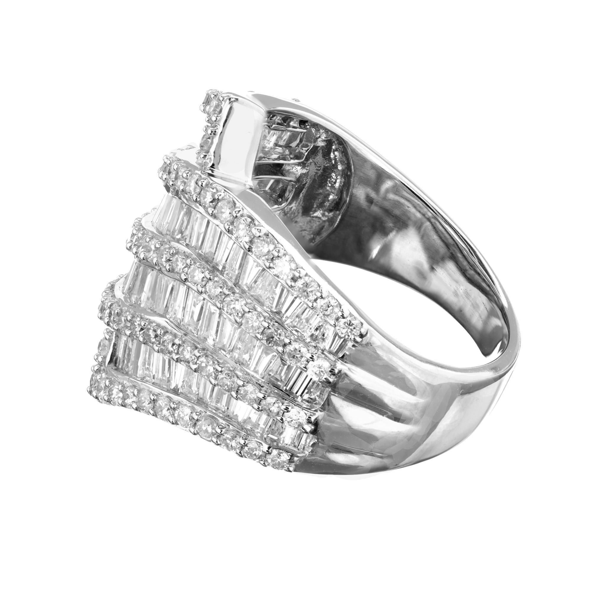 Wide diamond swirl cocktail ring. 14k white gold setting with nine rows of baguette and round diamonds. 

87 full cut diamonds, approx. total weight .80cts, H, SI
74 baguette cut diamonds, approx. total weight 2.00cts, H, SI
Size 8.75 and