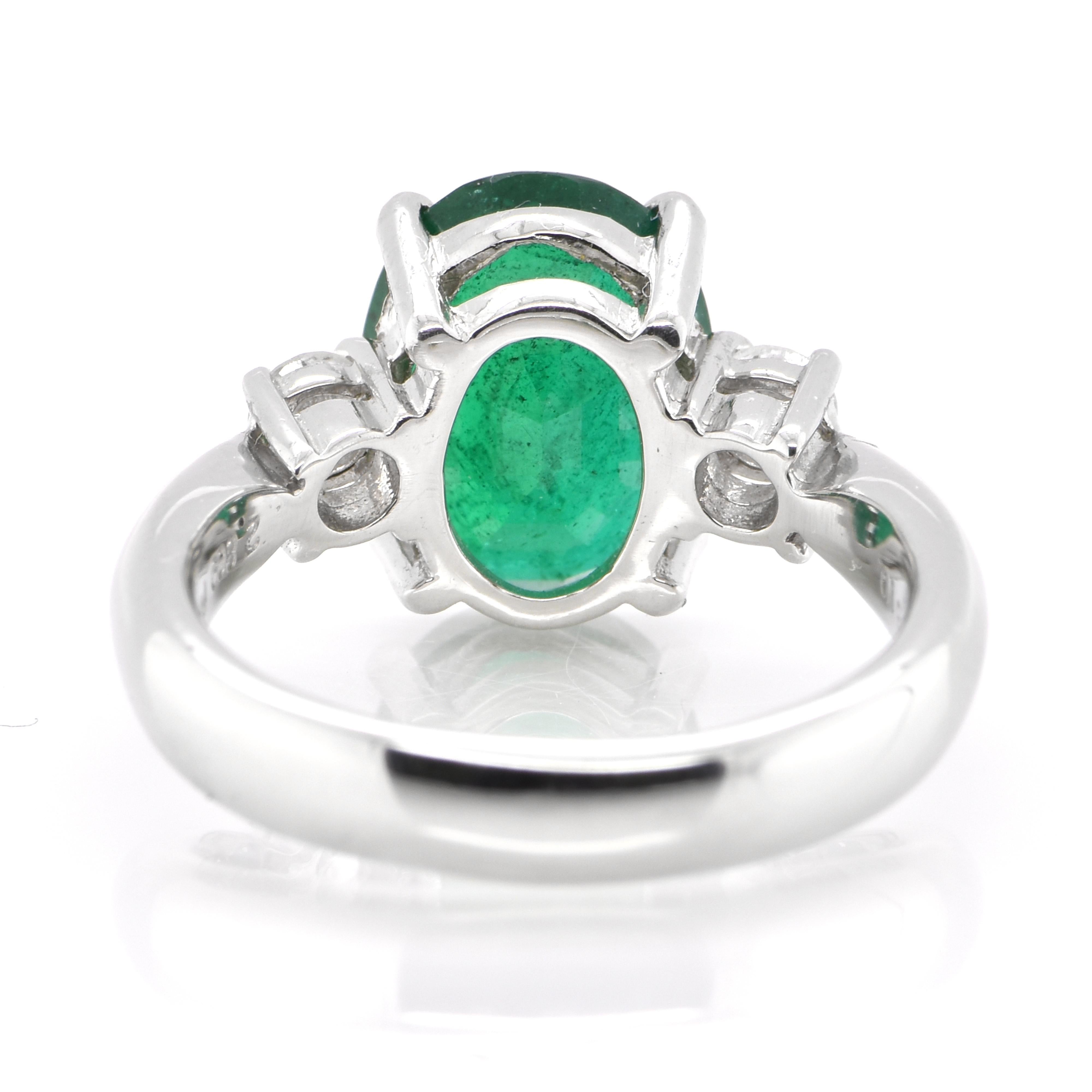 Oval Cut 2.80 Carat Natural Oval-Cut Emerald and Diamond Ring Set in Platinum For Sale