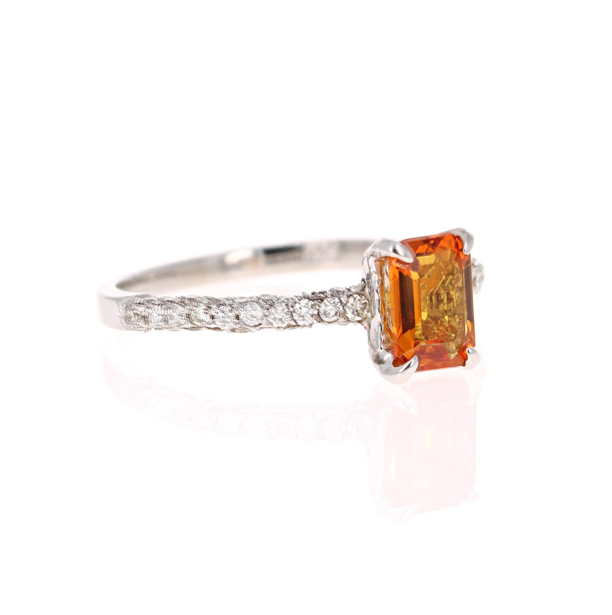 This beautiful ring has Natural Emerald Cut Orange Sapphire that weighs 1.04 Carats and is surrounded 54 Round Cut Diamonds that weigh 0.46 Carats. The total carat weight of the ring is 1.50 Carats. 

The ring is beautifully set in a classic 14