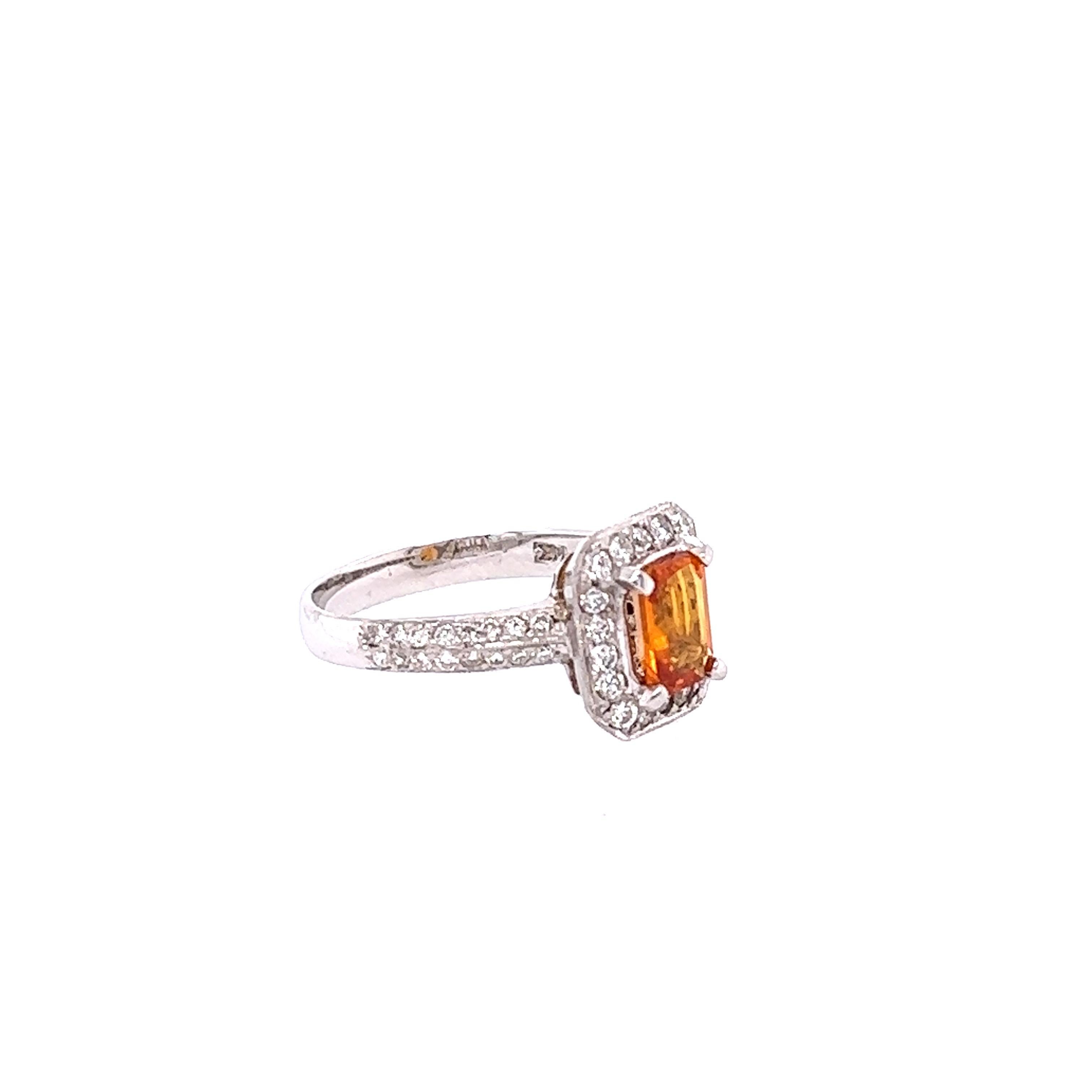This beautiful ring has Natural Emerald Cut Orange Sapphire that weighs 1.16 Carats and is surrounded by 50 Round Cut Diamonds that weigh 1.64 Carats. The total carat weight of the ring is 2.80 Carats. 

The ring is beautifully set in a classic 14