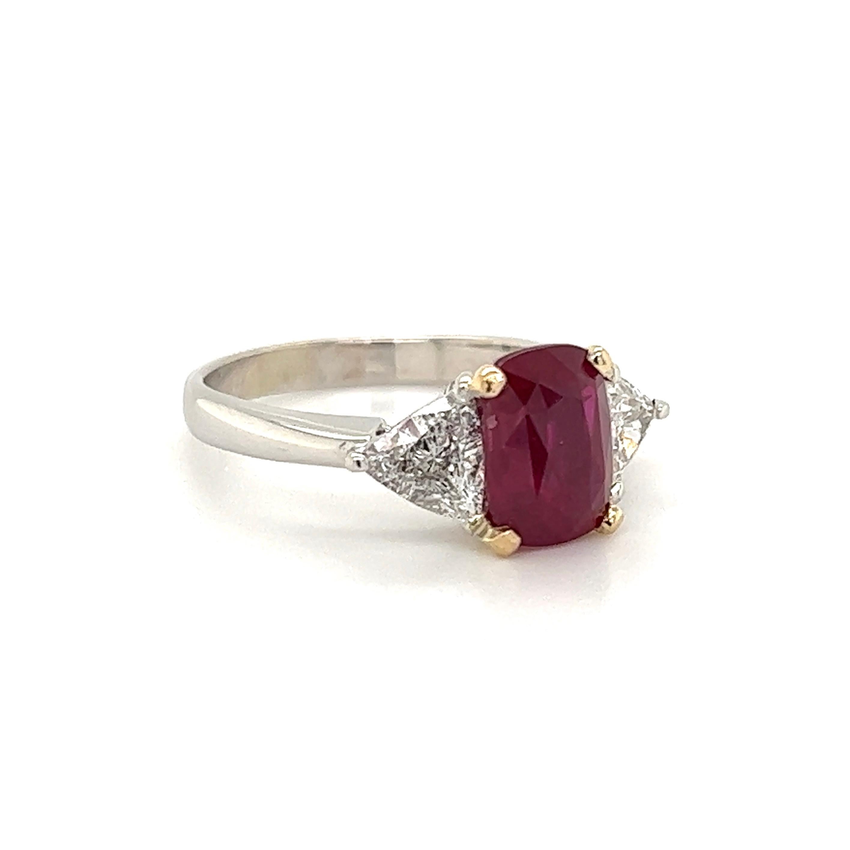 Simply Beautiful! Elegant and finely detailed Art Deco Revival 3-Stone Gold Ring, center securely nestled with an Antique Cut Ruby GIA, weighing approx. 2.80 Carats with a Trillion Diamond on either side; weighing approx. 0.60tcw. The ring is Hand