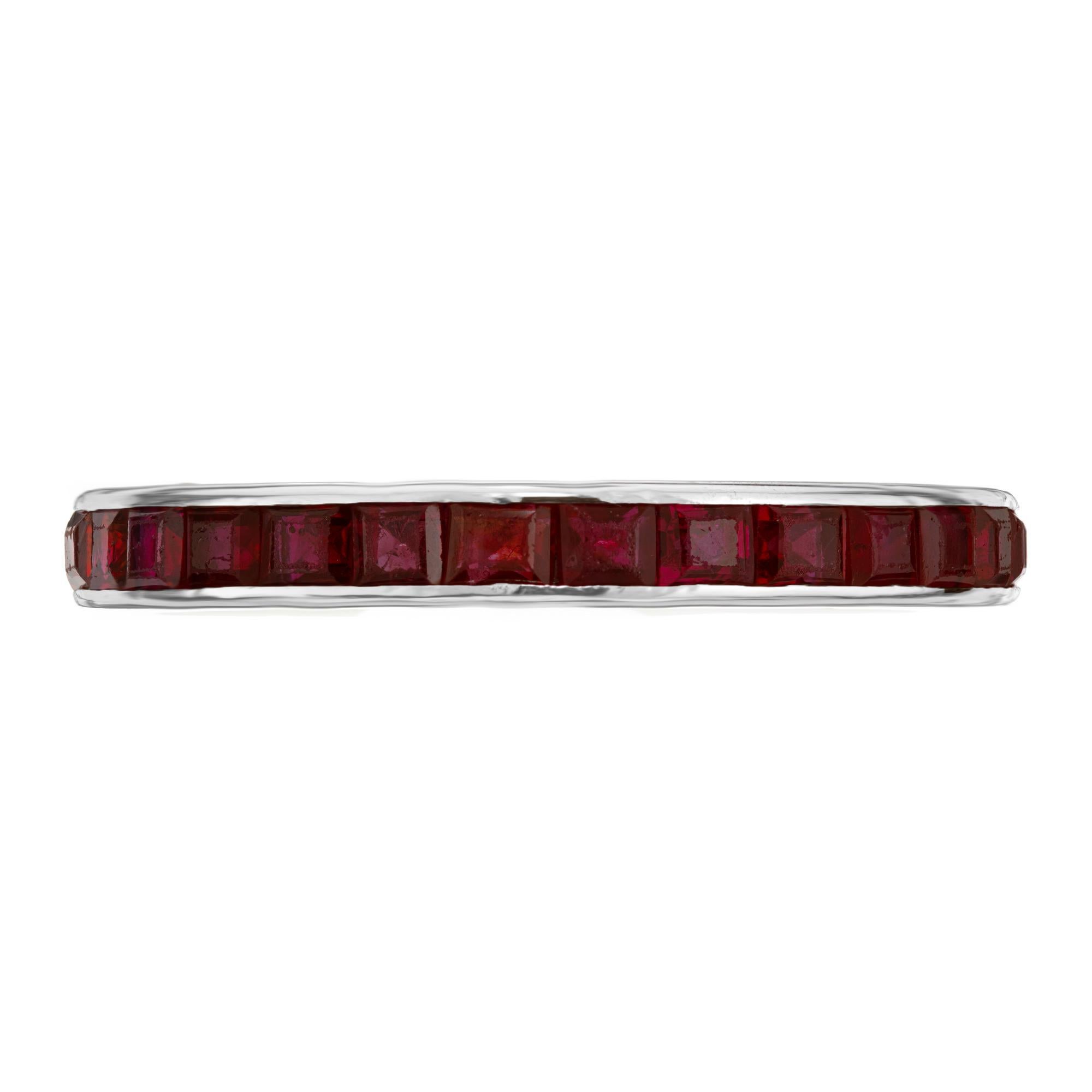 28 Square cut, channel set ruby platinum wedding band ring. This eternity wedding band boasts 28 square cut rubies totaling 2.80cts., that are set in a platinum mounting. The rubies are a rich deep red. A great alternative to a traditional band.