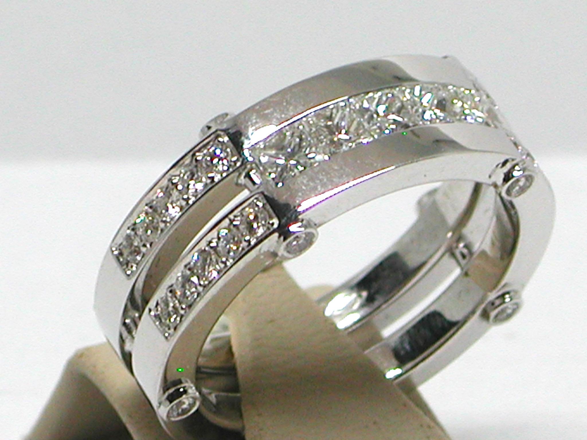 Gold: 18 carat white gold 
Weight: 16.05gr. 
Diamonds Total: 2,80 ct. colour: F clarity: VS1 
Princess Cut: 5 pieces of 0,32ct. Each 
Round Cut 30 pieces of 0,04ct. Each 
Width: 0,93 cm. 
Ring size: free adjustment of ring up to size 80 / 25mm 
All
