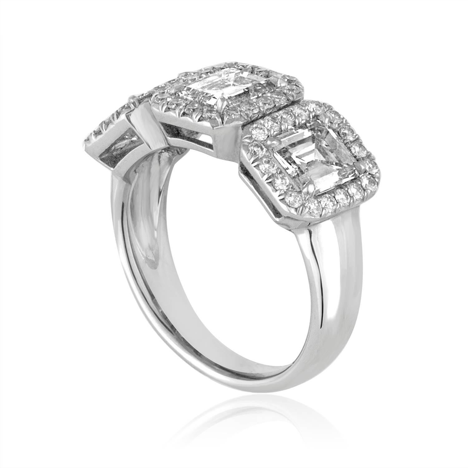 3 Stone Emerald Cut Diamonds Set in 18K White Gold Ring
The 3 Emerald Cut Diamonds 2.30Ct I VS
The 3 stones are surrounded small Diamonds.
There are 0.50Ct Small Diamonds G VS.
The ring is a size 6, sizable.
The ring weighs 7.2 grams