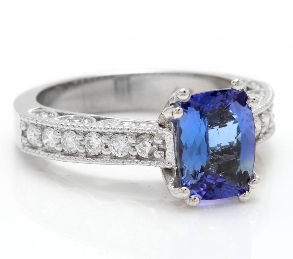 2.80 Carats Natural Very Nice Looking Tanzanite and Diamond 14K Solid White Gold Ring

Total Natural Trillion Cut Tanzanite Weight is: Approx. 2.10 Carats

Tanzanite Measures: Approx. 9.00 x 7.00mm

Natural Round Diamonds Weight: Approx. 0.70 Carats