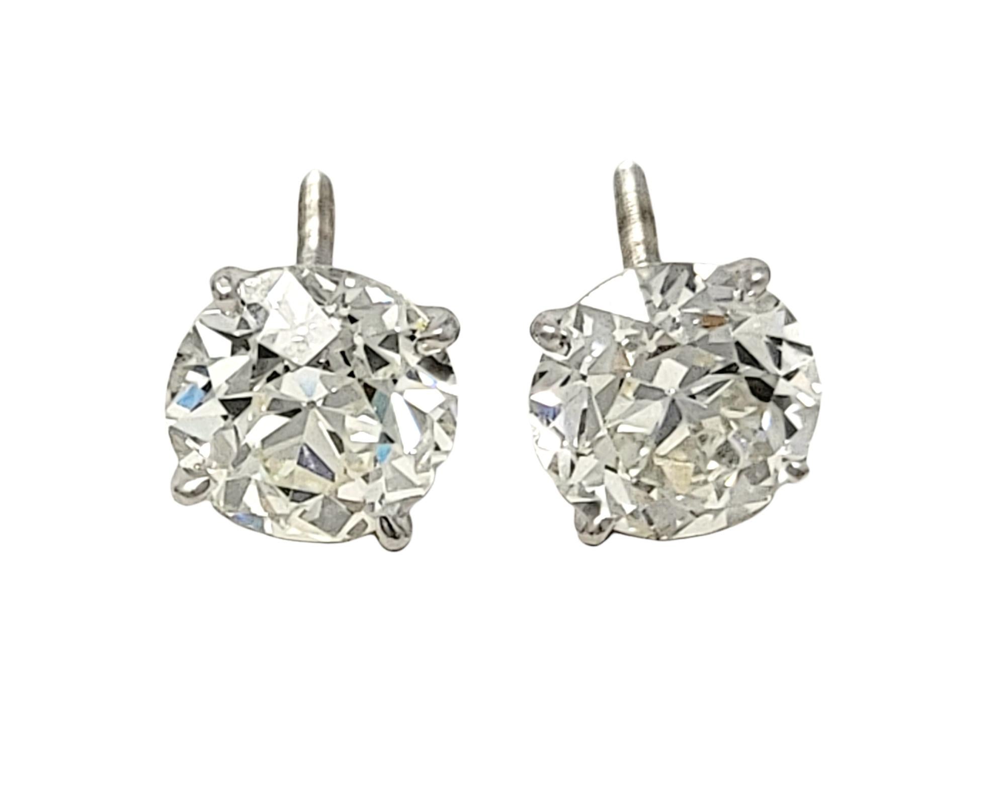 These incredibly gorgeous diamond solitaire stud earrings will absolutely light up your lobe. The stunning round diamond and white gold pierced ear studs are the epitome of minimalist elegance. The simple yet elegant design can be worn with just