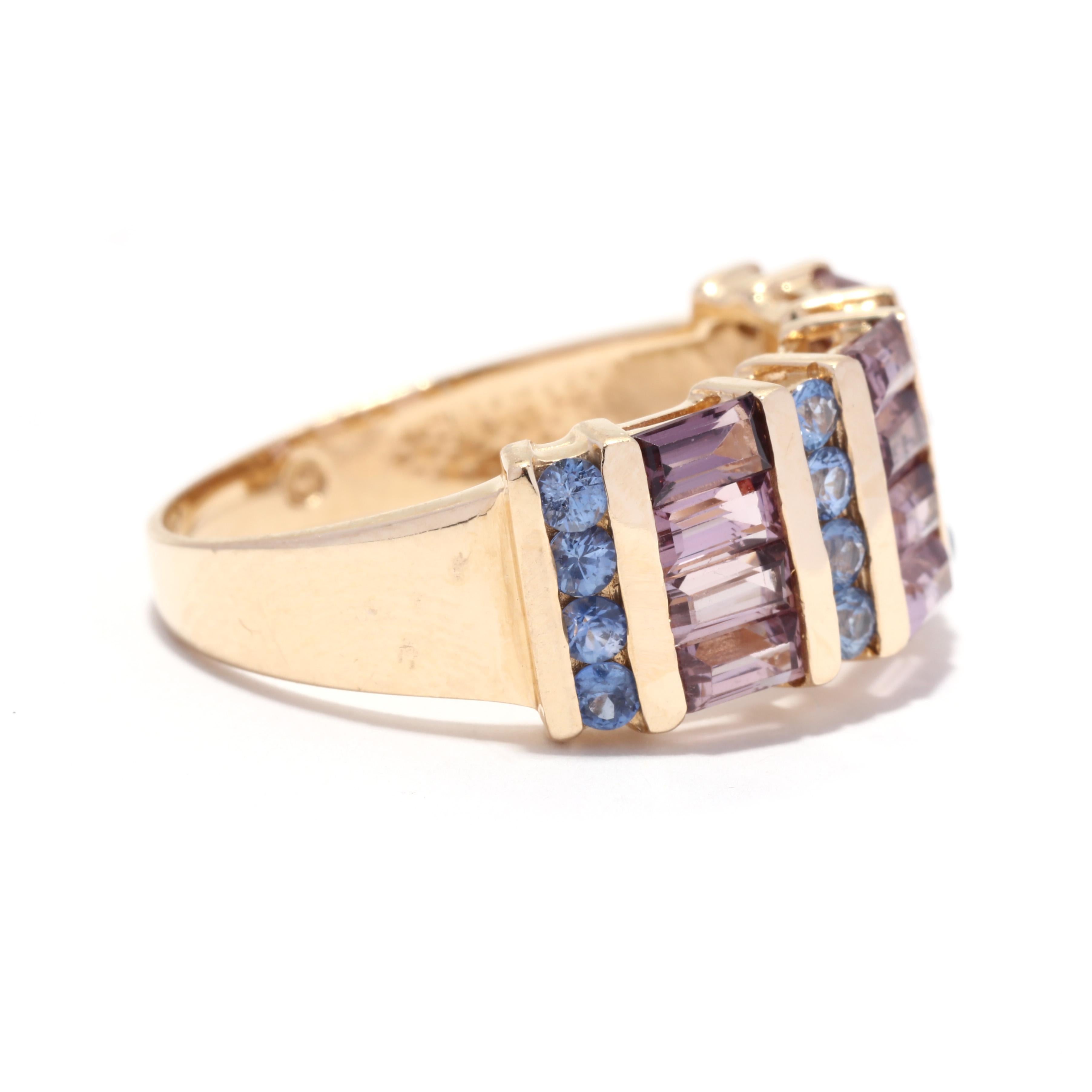 A vintage 14 karat yellow gold purple and blue sapphire wide band ring. This Art Deco style ring features alternating rows of channel set round cut but sapphires weighing approximately .64 total carats with baguette cut purple sapphires weighing