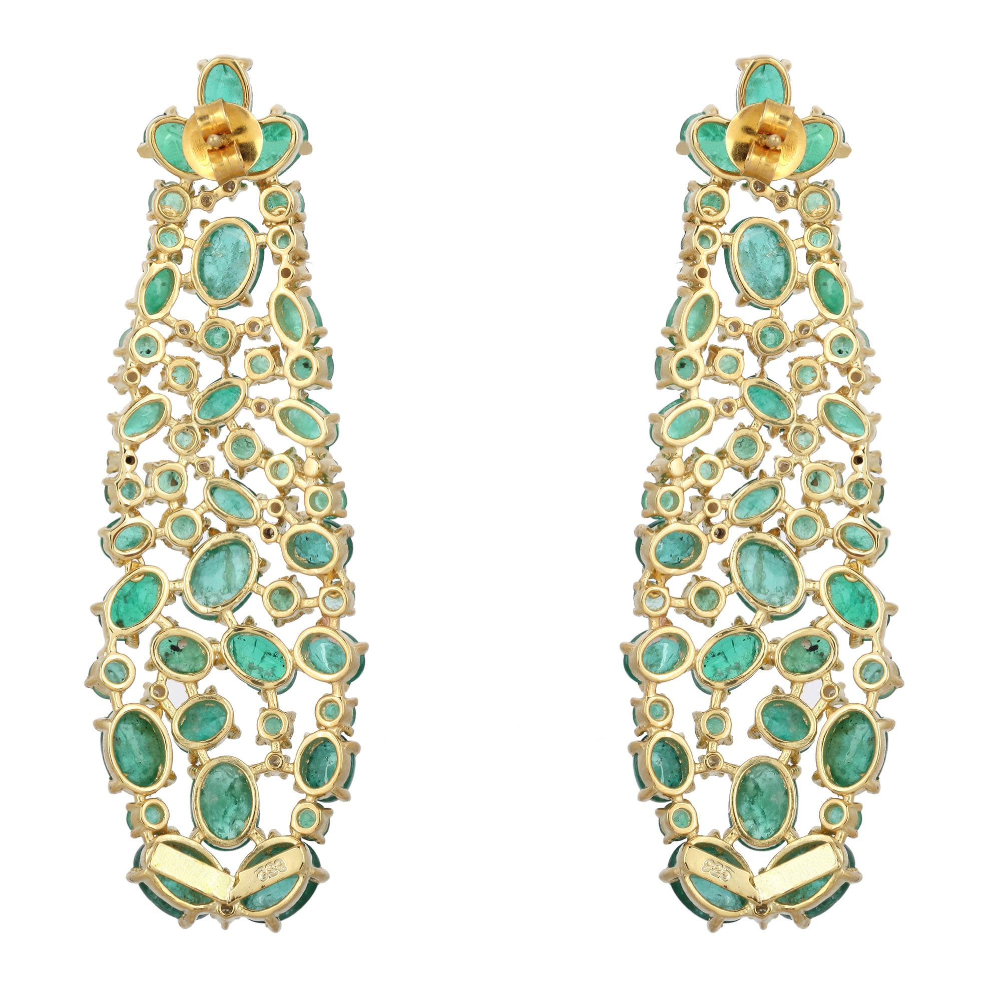 These stunning earrings are thoughtfully and meticulously crafted in 18-karat gold and sterling silver. It is set in 28.06 carats emerald and .38 carats of glimmering diamonds. See other pieces in fluid collection.

FOLLOW  MEGHNA JEWELS storefront