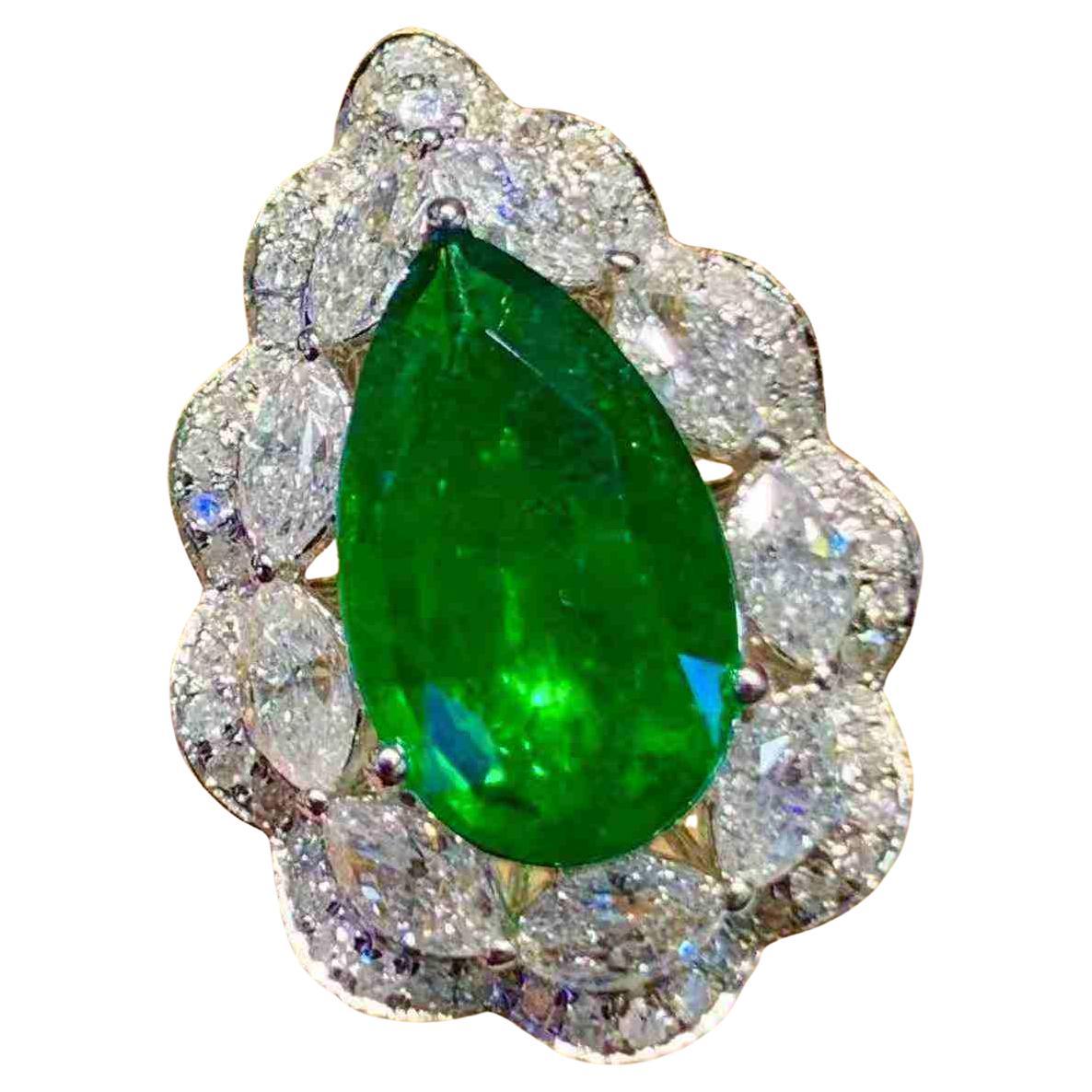 2.80ct Pear Cut Emerald
1.20ct Diamond Halo Ring in 18K White Gold