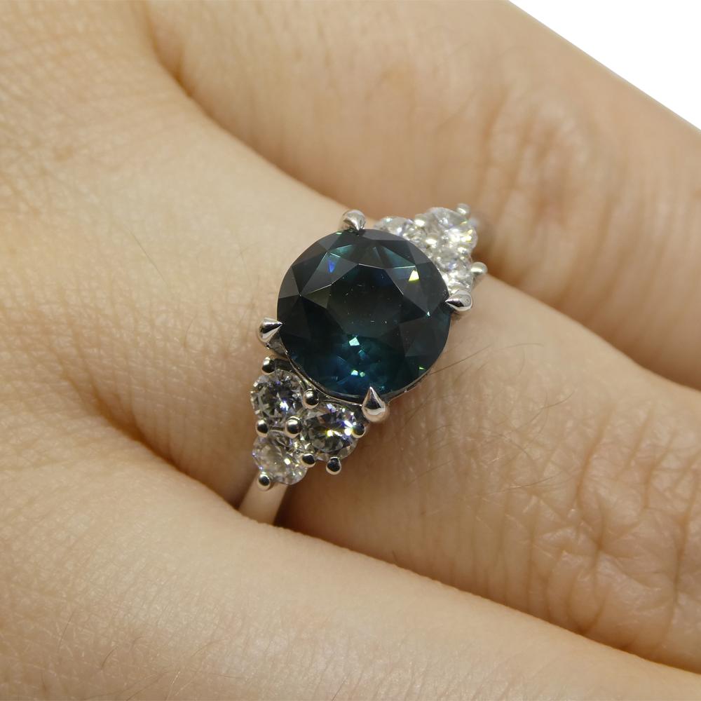  
Introducing the Exquisite 2.80ct Round Teal Blue Sapphire & Diamond Statement/Engagement Ring Set in 14K White Gold, GIA Certified from Thailand.


Elevate your style and make a bold statement with this captivating 2.80ct Round Teal Blue Sapphire