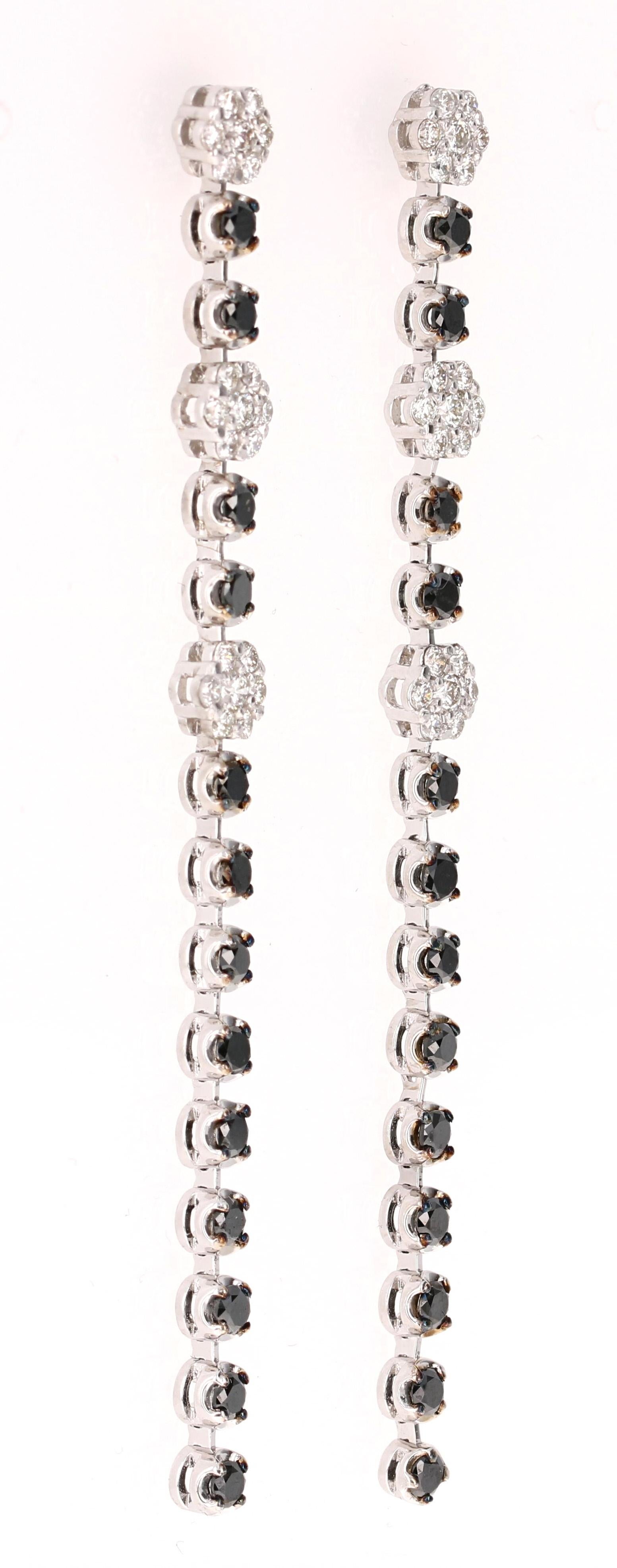 The most stunning Black and White Diamond Earrings! Classy and Chic! 

These beauties have 26 Round Cut Black Diamonds that weigh 1.88 Carats and 42 Round Cut White Diamonds that weigh 0.93 Carats (Clarity: VS, Color: H). The total carat weight of