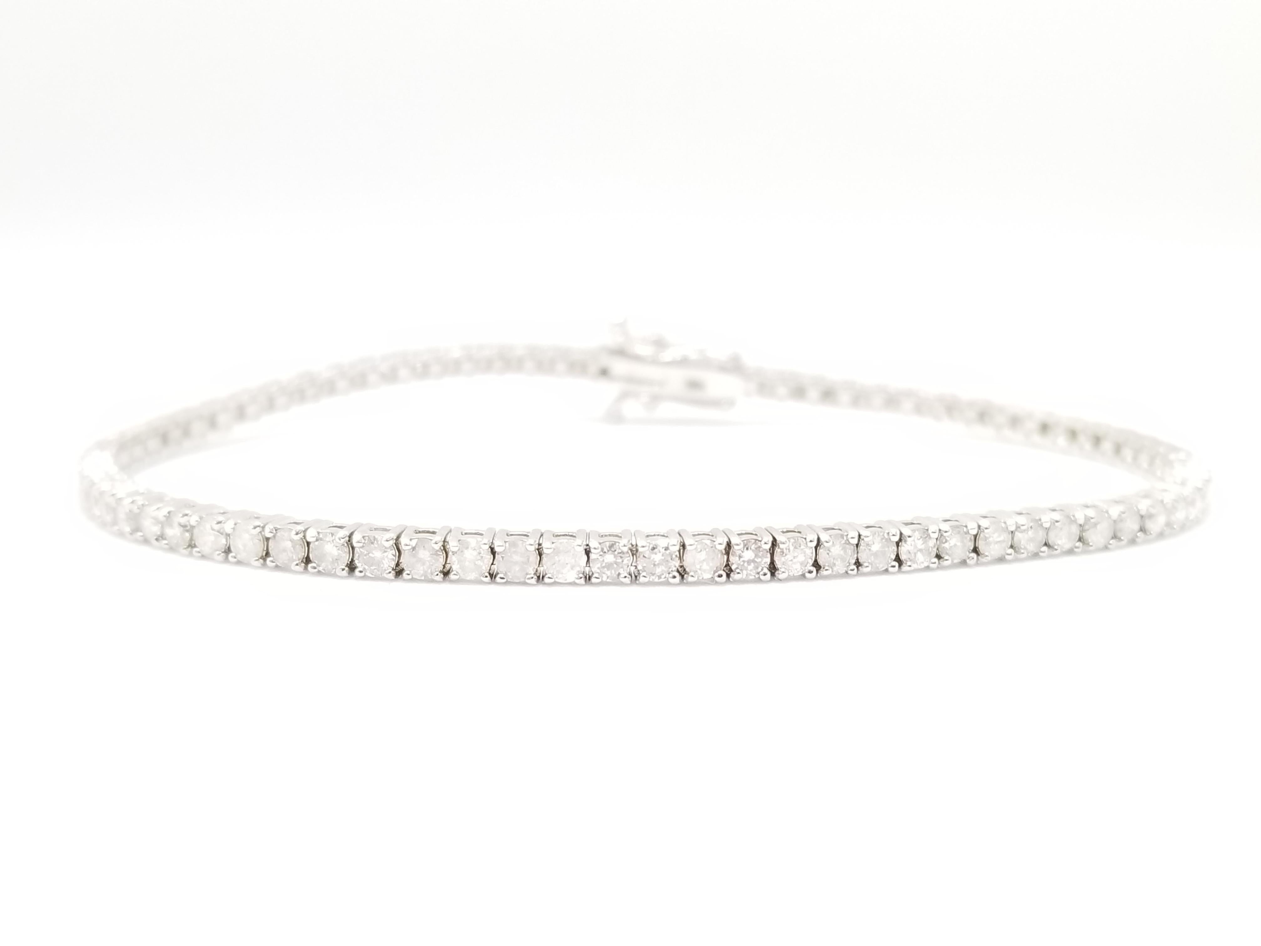 Exquisite style for everyday wear, Beautiful round-brilliant cut diamonds, set on 14k white gold. each stone is set in a classic four-prong style for maximum light brilliance. 7 inch length. Color F, Clarity SI-I1. 2.3 mm wide. Luxury for every