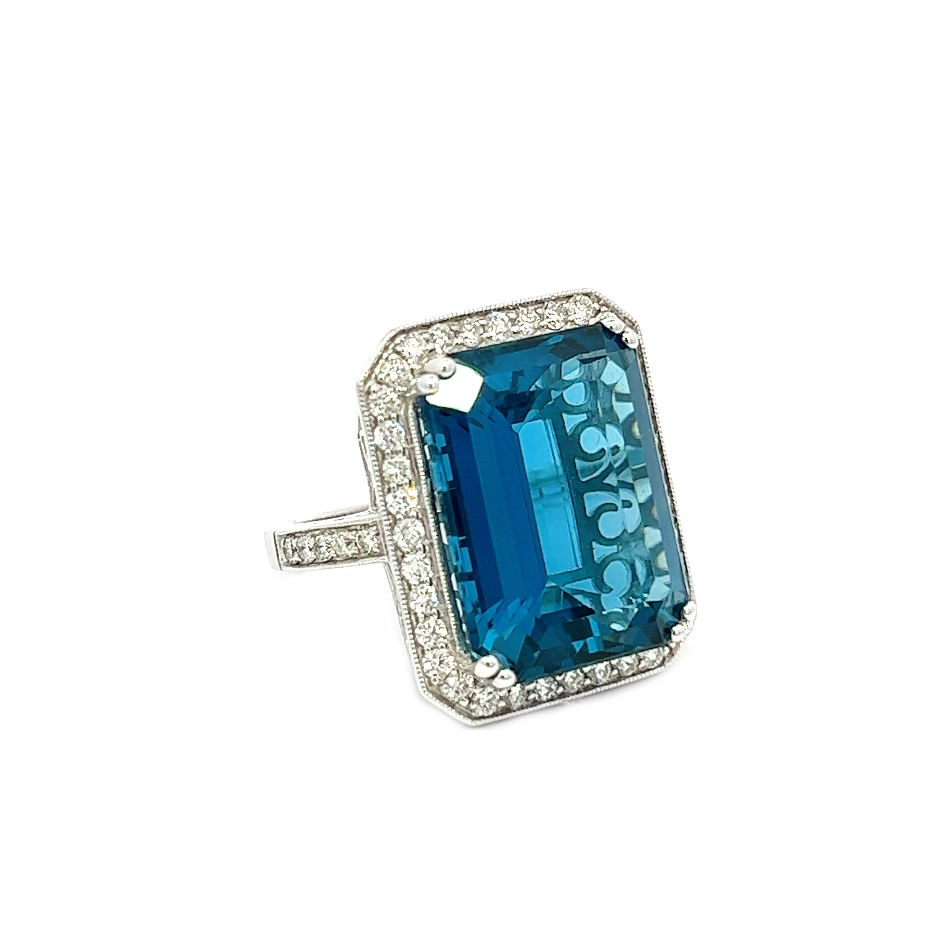This exquisite ring features a stunning emerald-cut London Blue Topaz that is perfectly complemented by round brilliant diamonds in H Color and VS Clarity. The ring is expertly crafted in 14k white gold, making it a timeless and elegant piece of