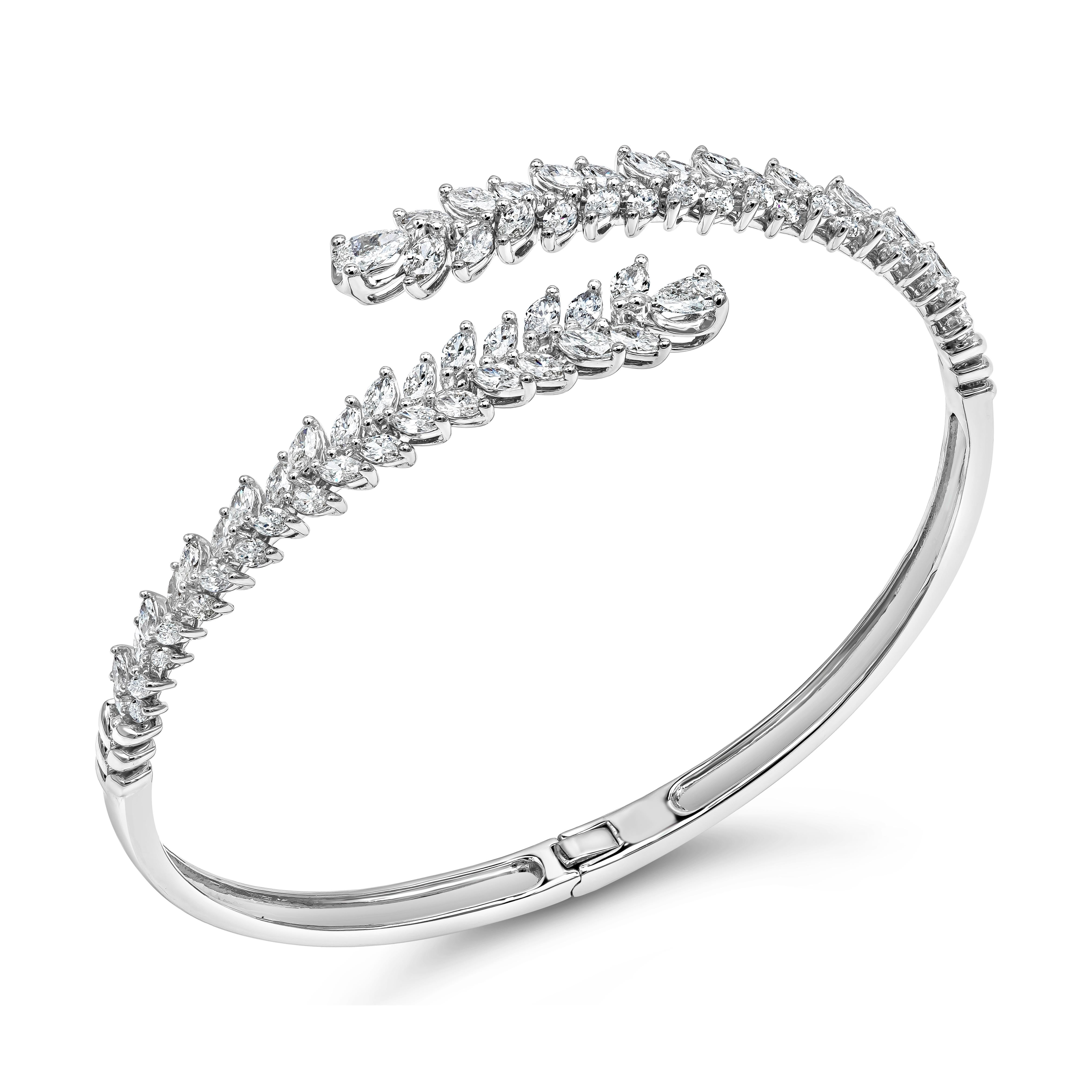 A unique and fashionable bangle bracelet showcasing brilliant marquise and pear shape diamonds, set in a bypass wreath design. Diamonds weigh 2.82 carats total, F-G Color and VS-Si in Clarity. Made with 18K White Gold

Roman Malakov is a custom