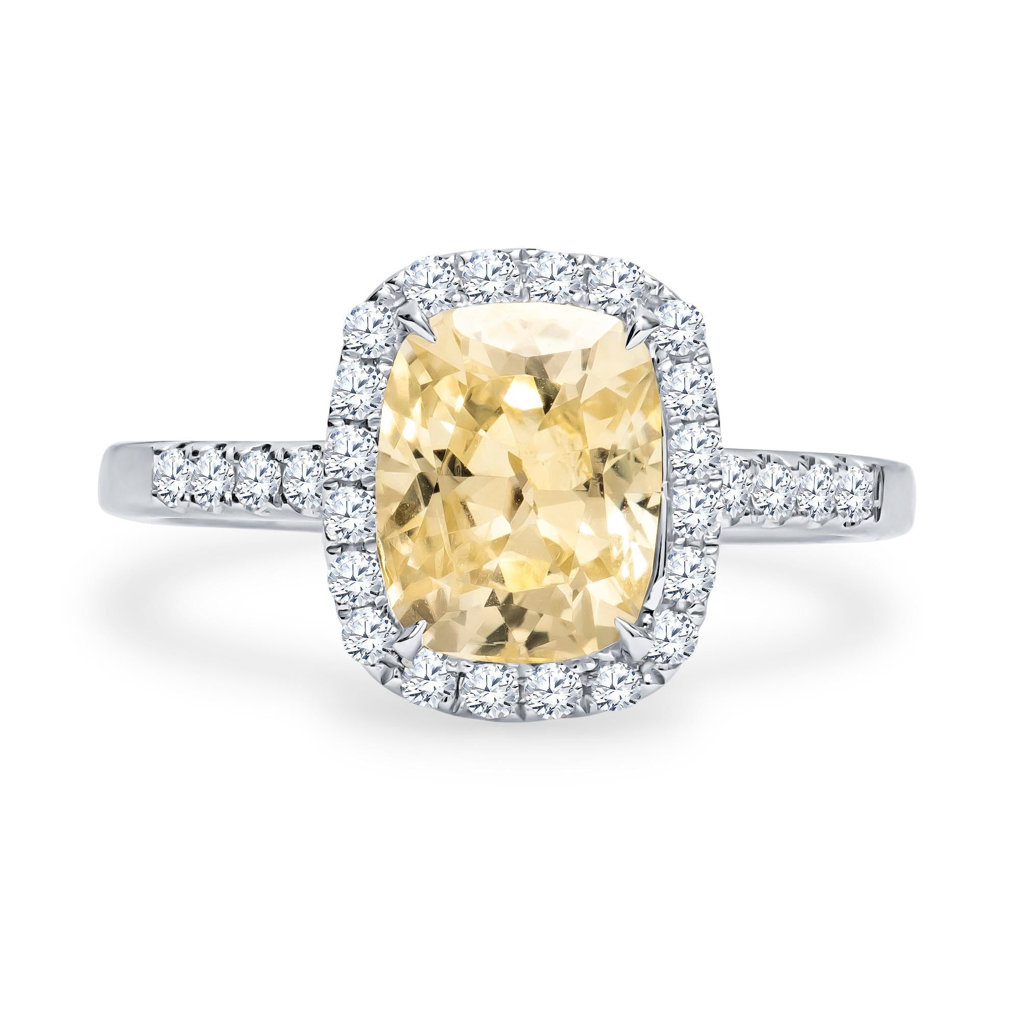 18K white gold ring with a 2.82 carat cushion cut natural no heat Sri Lanka (Ceylon) yellow sapphire with a GIA laboratory report, and 0.40 carats total weight in round diamonds placed in halo and upper shank. This stunning ring was custom designed
