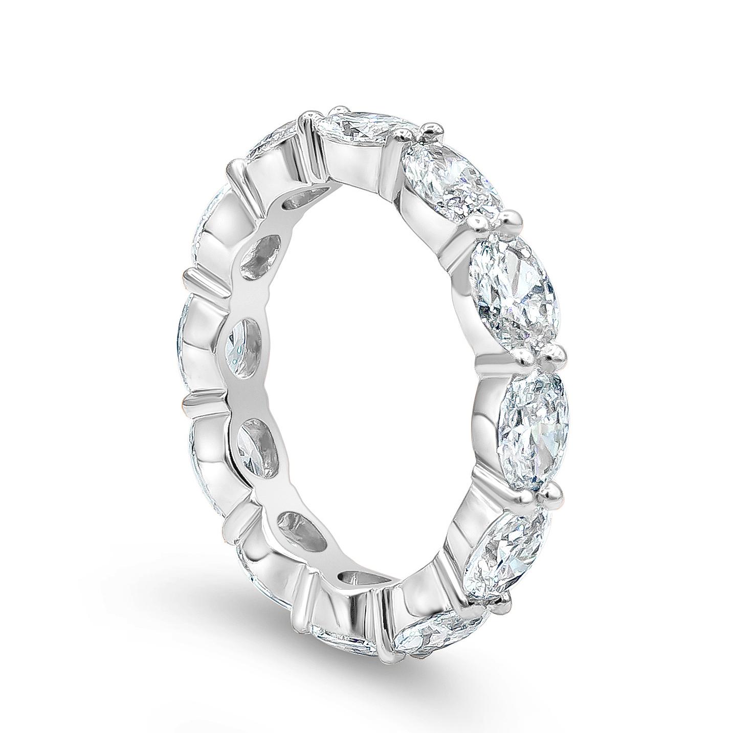 This chic eternity wedding band ring features 13 brilliant oval shaped diamonds weighing 2.82 carats total. The oval diamonds are set horizontally and the stones are matched perfectly. Set in a shared-prong setting, Made with Platinum. Size 6.25