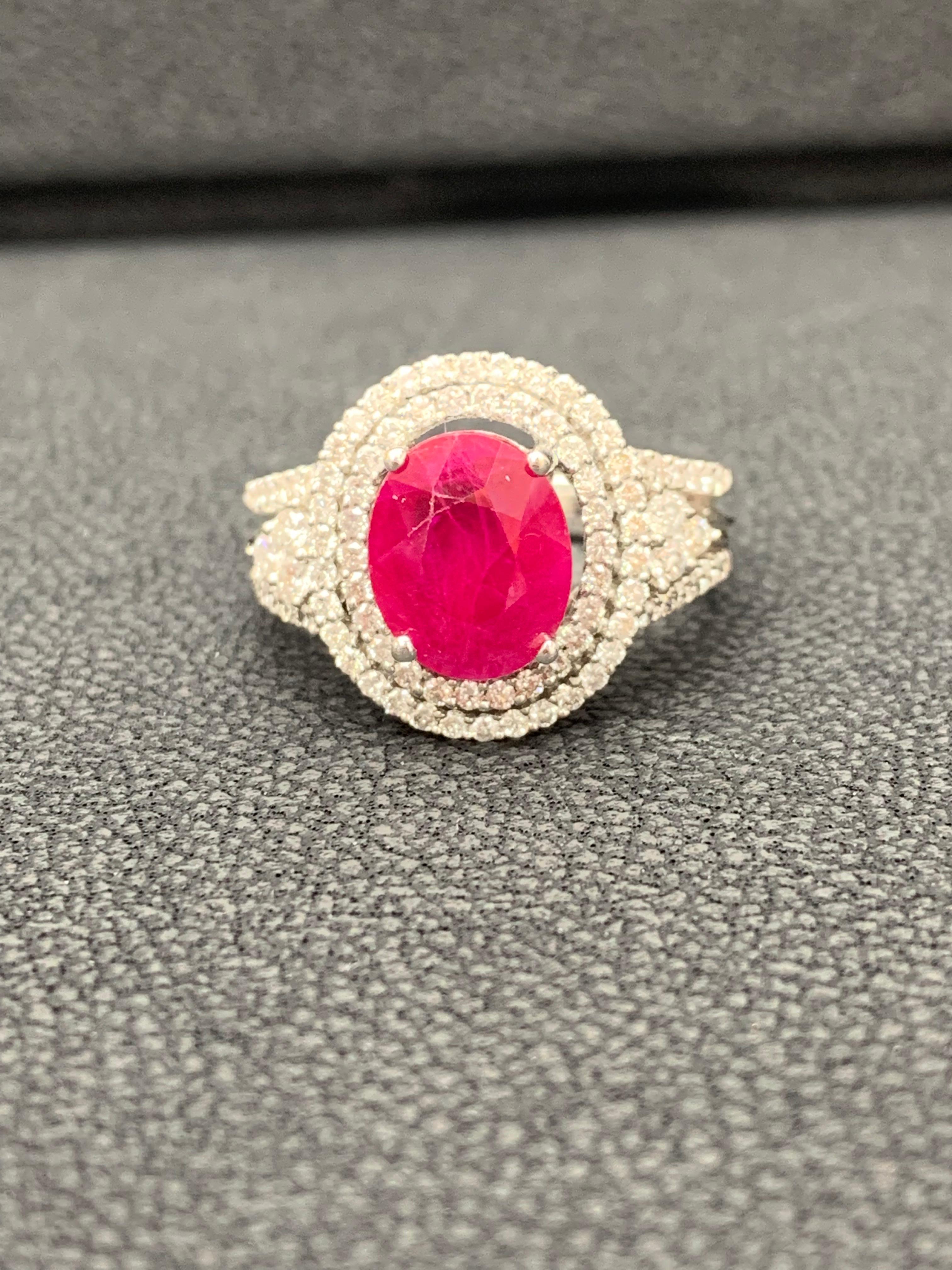 A color-rich engagement ring style showcasing a 2.82 carat oval cut red ruby, accented by a double row of round brilliant diamonds set in a 18k white gold setting. 90 Diamonds weigh 0.73 carats total.

Size 6.5 US (Sizable). One of a Kind 