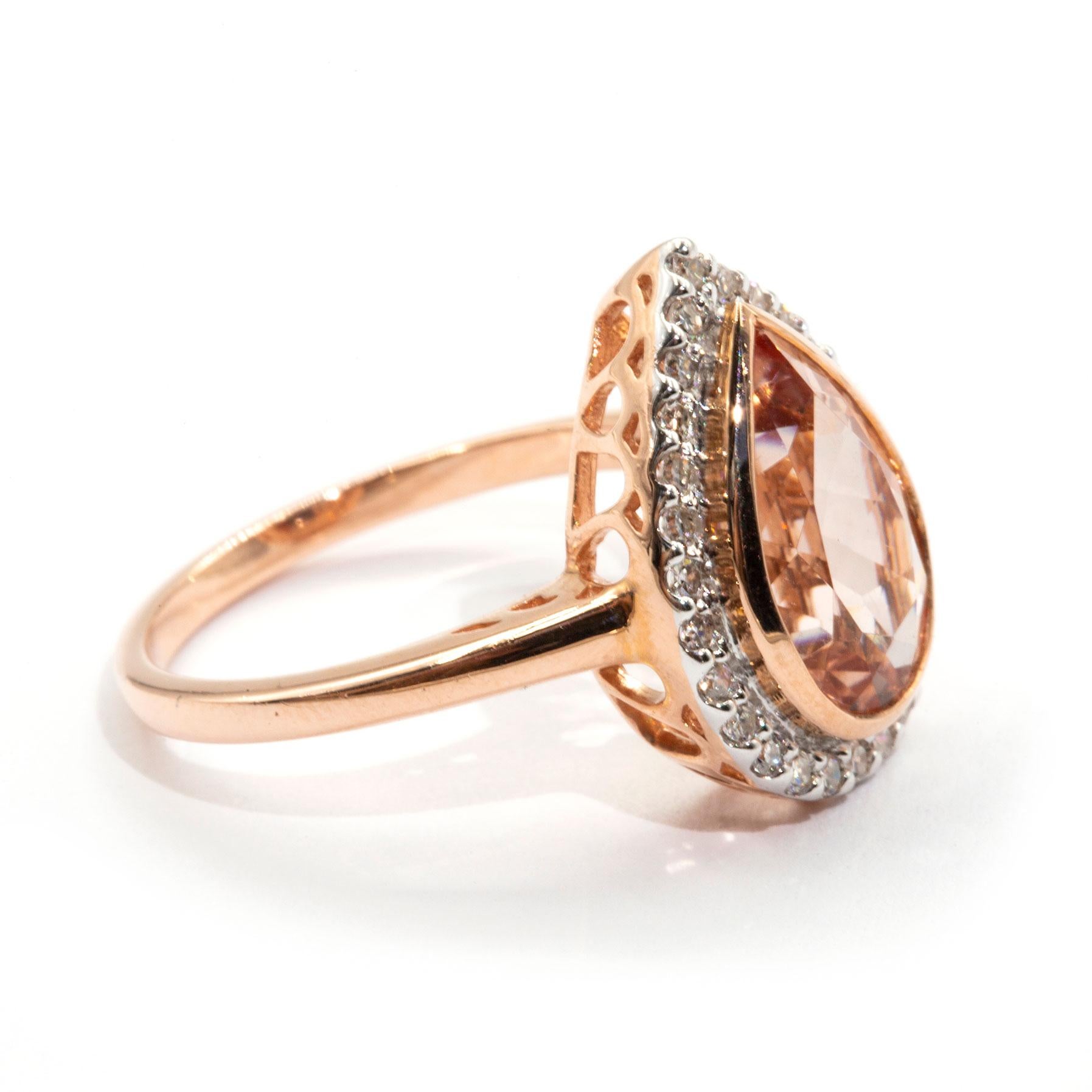 Contemporary 2.82 Carat Pear Cut Morganite and Diamond Halo Cluster 9 Carat Rose Gold Ring
