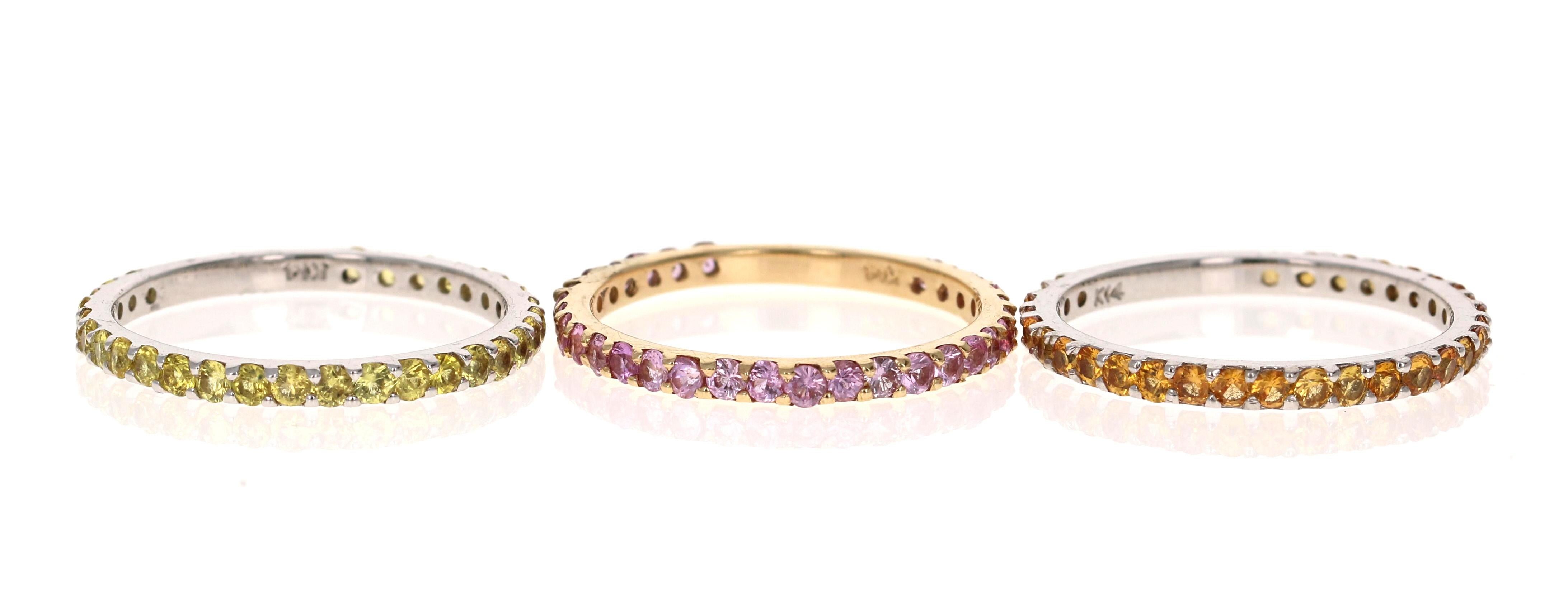 2.82 Carat Round Cut Pink Sapphire, Yellow Sapphire and Orange Sapphire White and Yellow Gold Stackable Bands!

Set of 3 elegant and classy 2.82 Carat Sapphire bands that are sure to be a great addition to your accessory collection!   There are 30