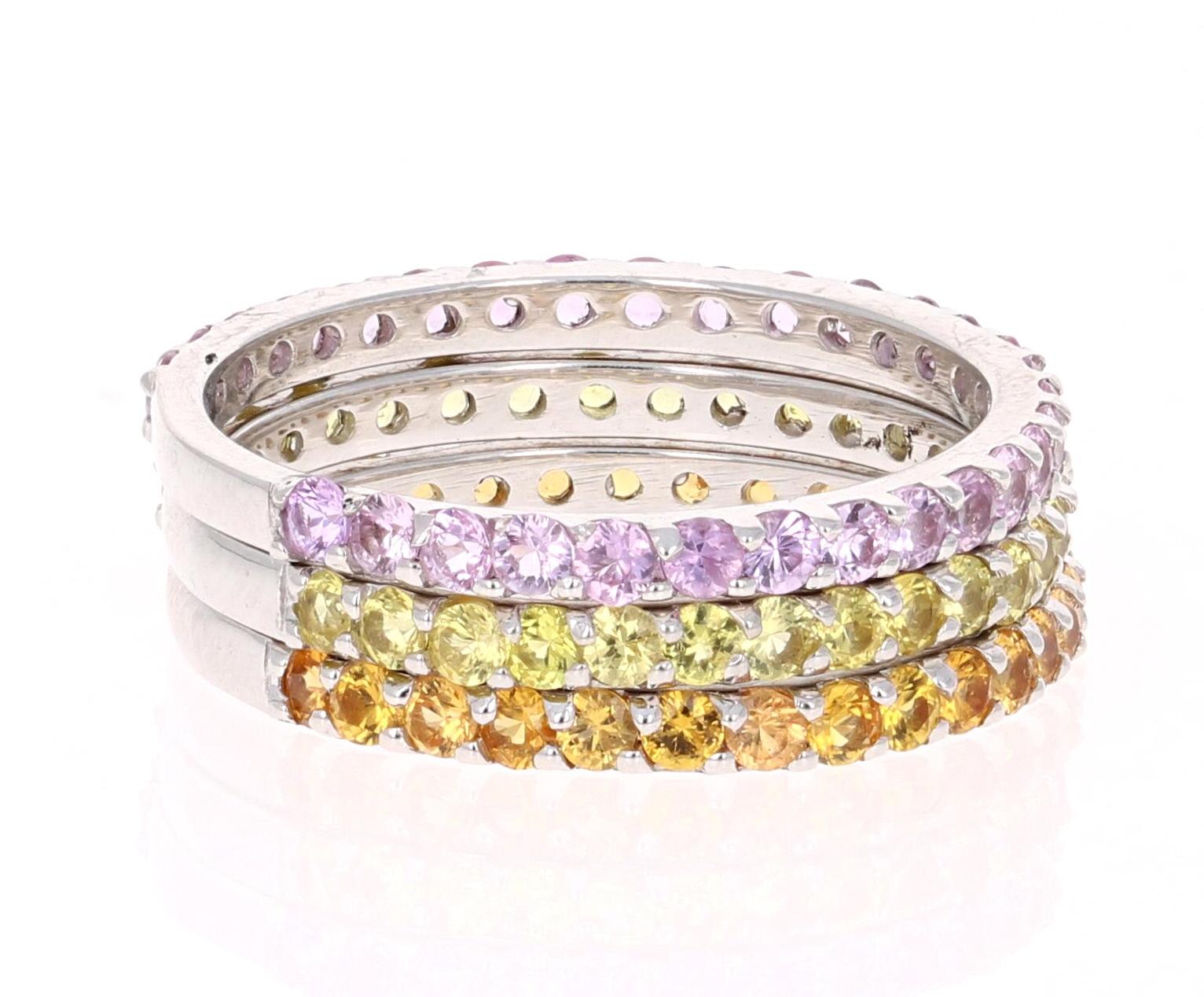 2.82 Carat Round Cut Pink Sapphire, Yellow Sapphire and Orange Sapphire White Gold Stackable Bands!

Set of 3 elegant and classy 2.82 Carat Sapphire bands that are sure to be a great addition to your accessory collection!   There are 30 Round Cut